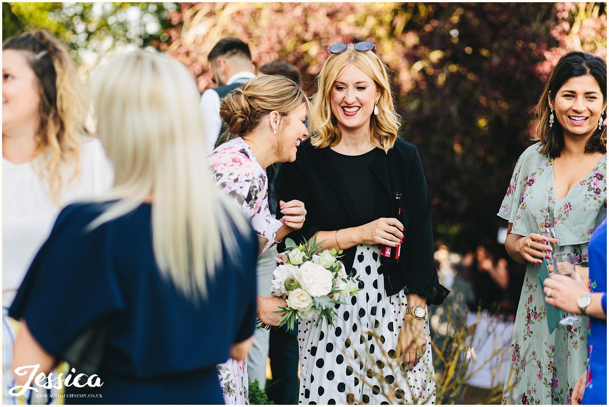 guests laughing &amp; having fun during drinks reception