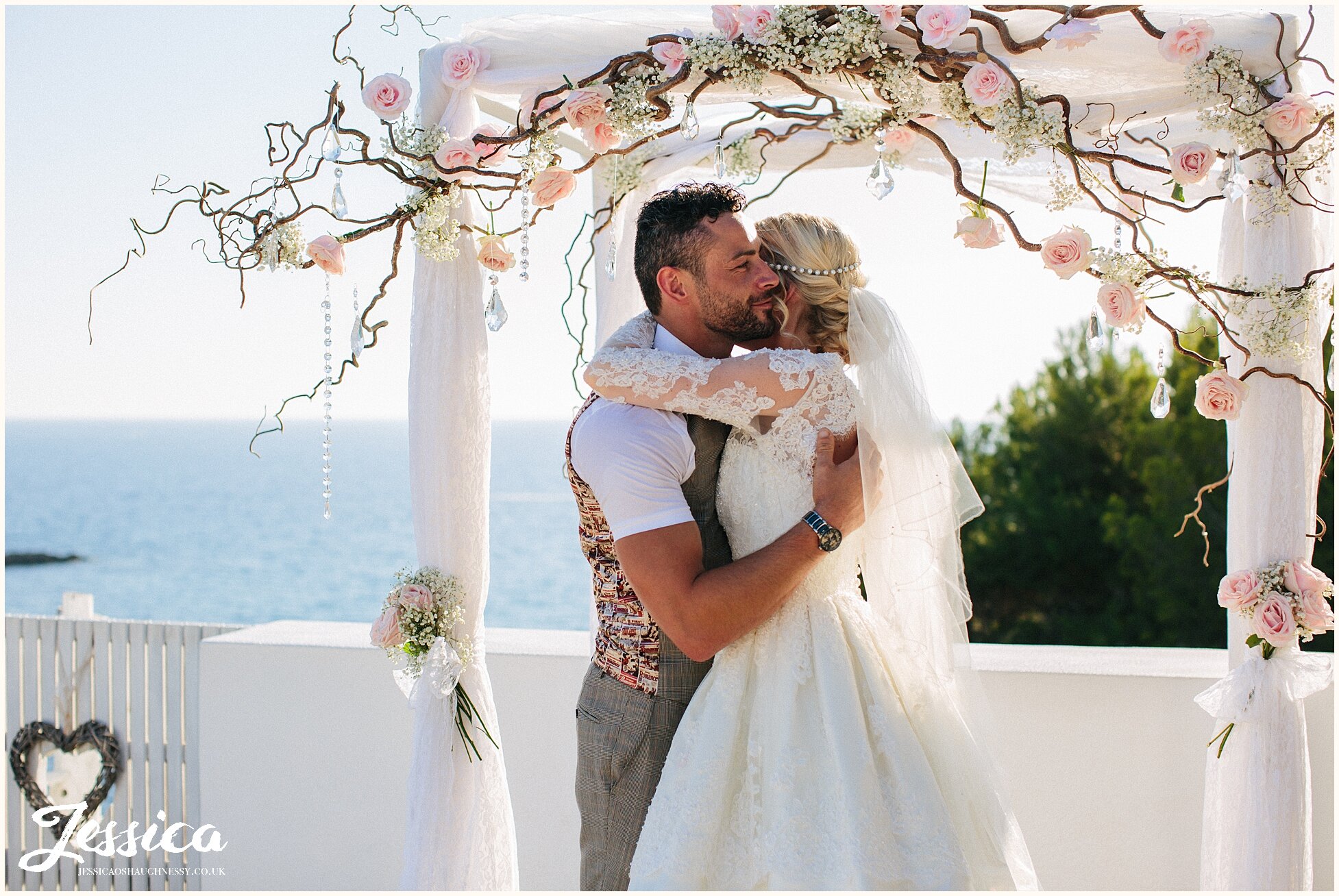 bride &amp; groom embrace during their wedding at Elixir, Ibiza