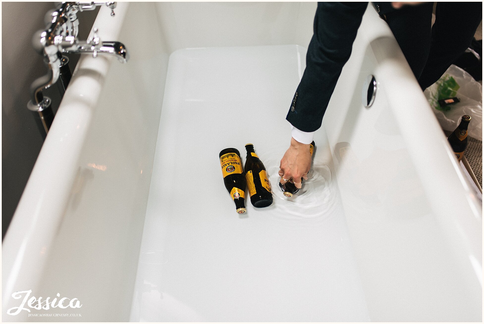 groomsmen keep beers in the bath to keep them cool