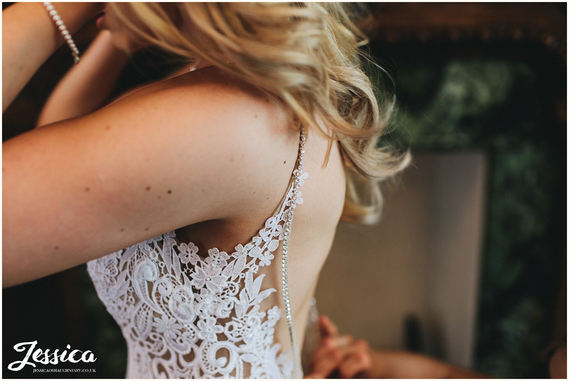 bride wears beautiful lace wedding dress