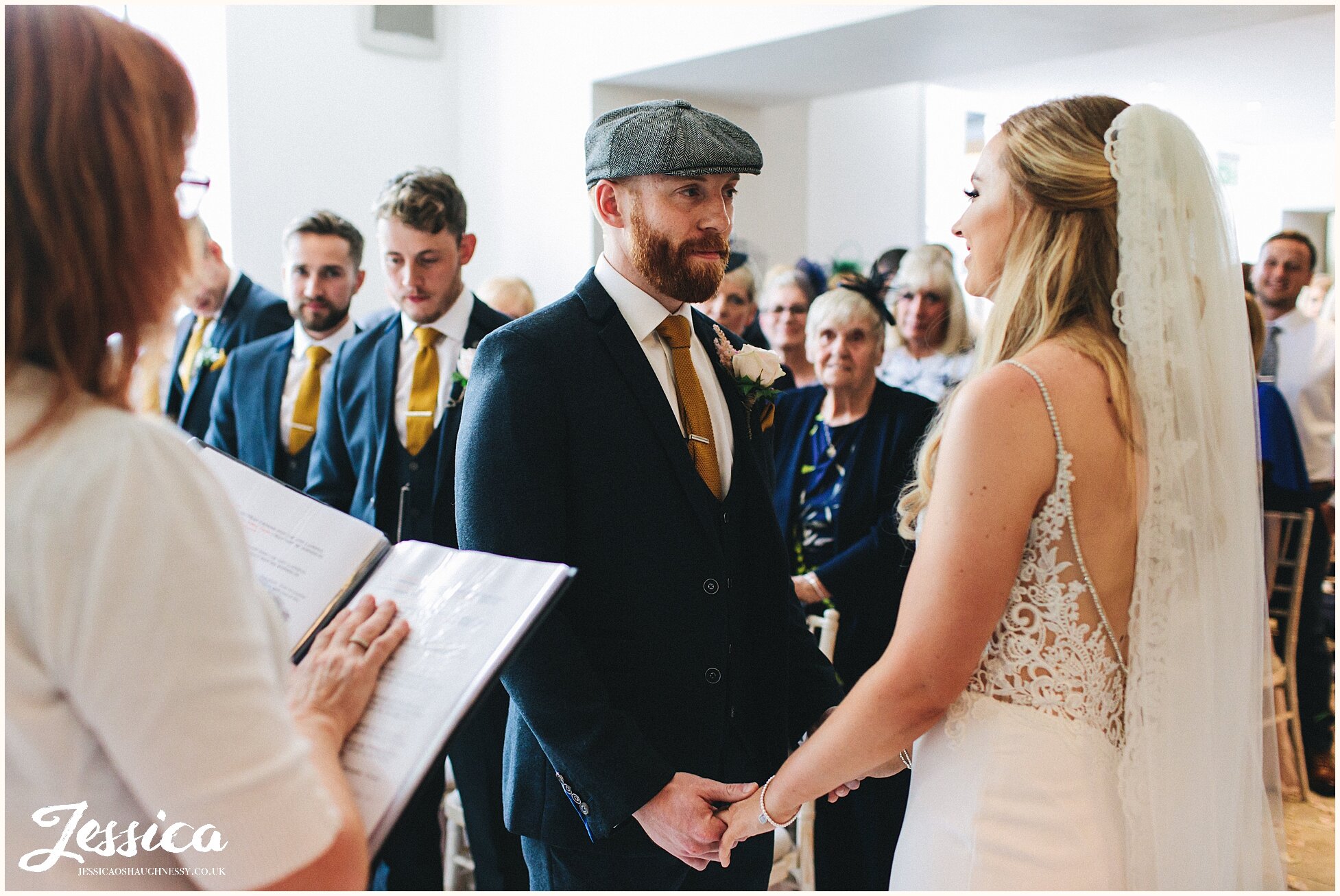 groom looks lovingly at his bride - north wales wedding photographer