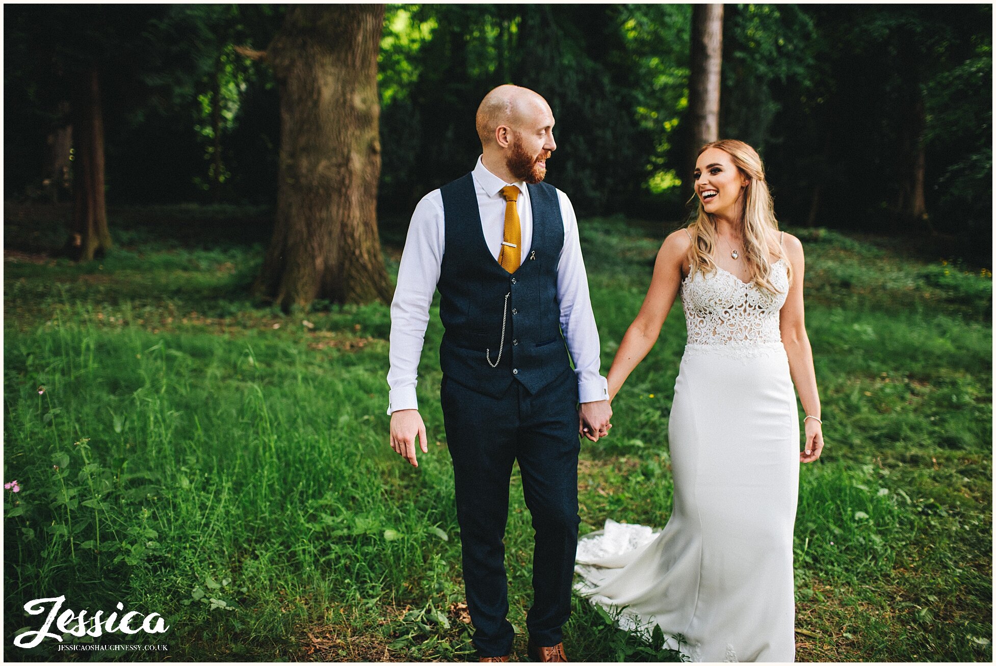 newly wed's walk through the tree's on their wedding day