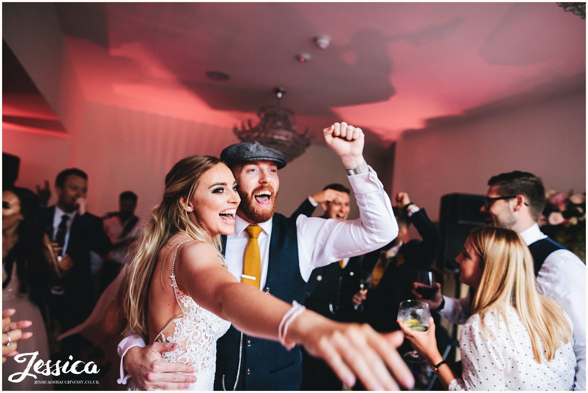 newly wed's dance to as the band sings during their wedding reception