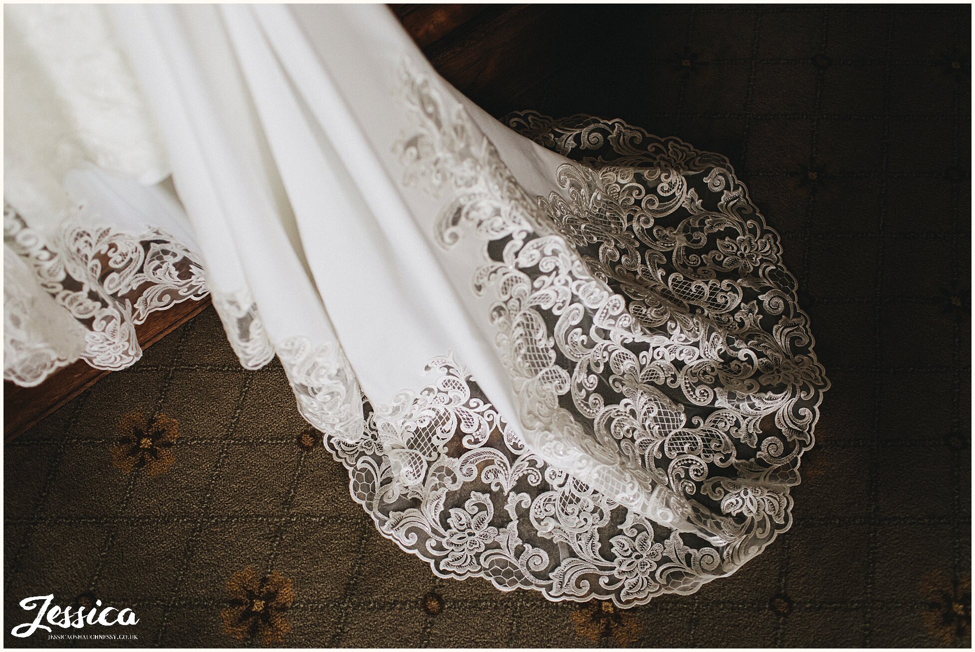 the lace train of the wedding dress