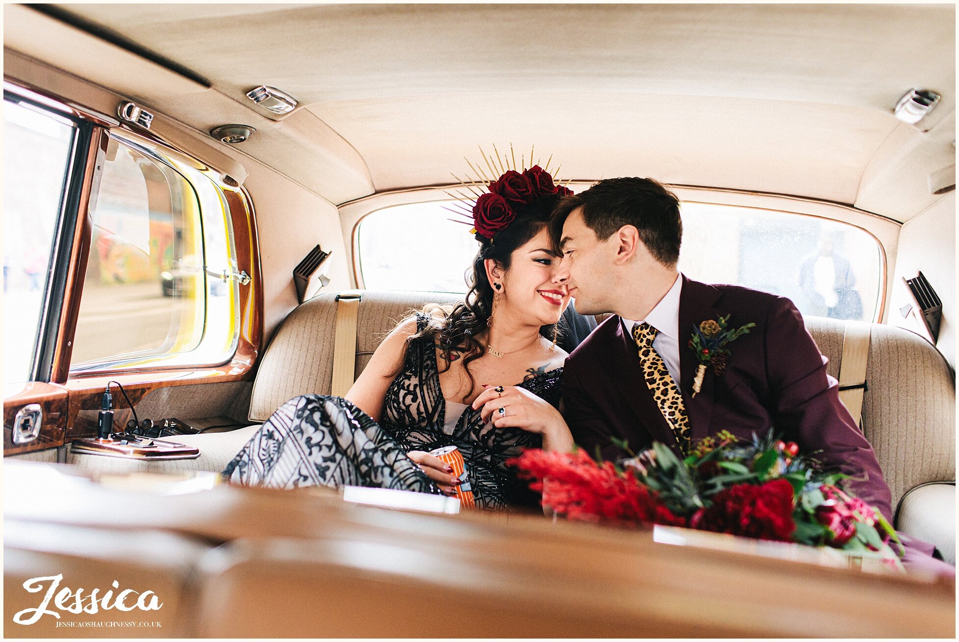 gothic glam couple in wedding car
