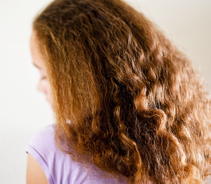 The before look: super dry, frizzy and so many products in her hair to tame it. 