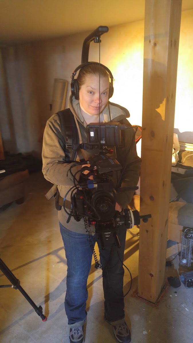 My wife steps behind the camera on our last shoot while I stepped in front of it. Here she is wearing the Easyrig with the C100 Mark II rigged out.
