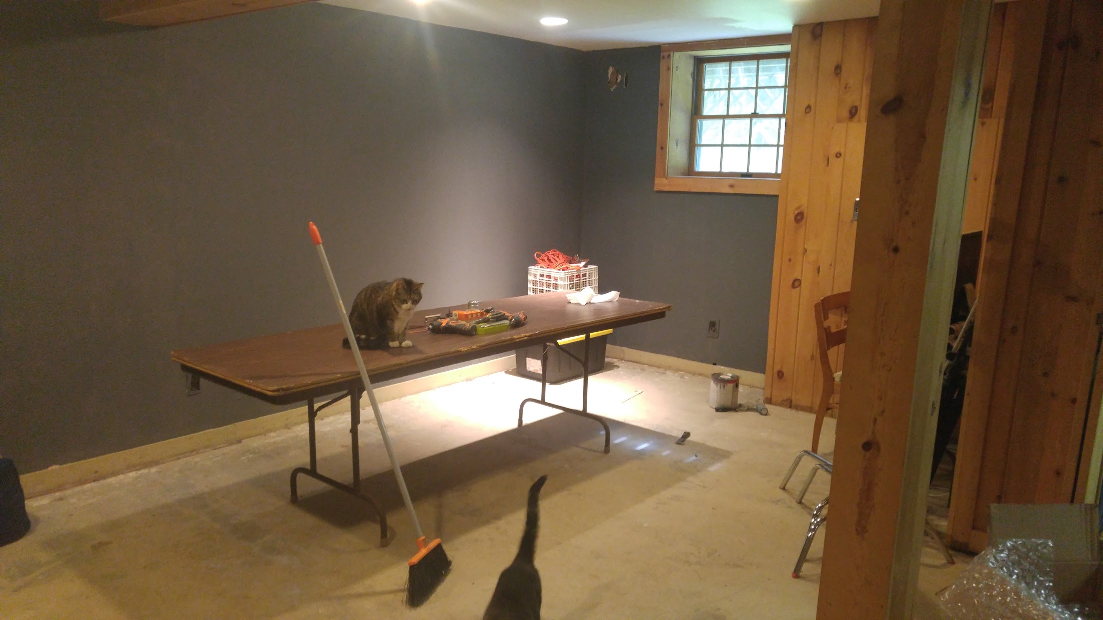 The corner we shot into with the wall now painted a solid gray. You can see at top of frame how low the ceiling is.
