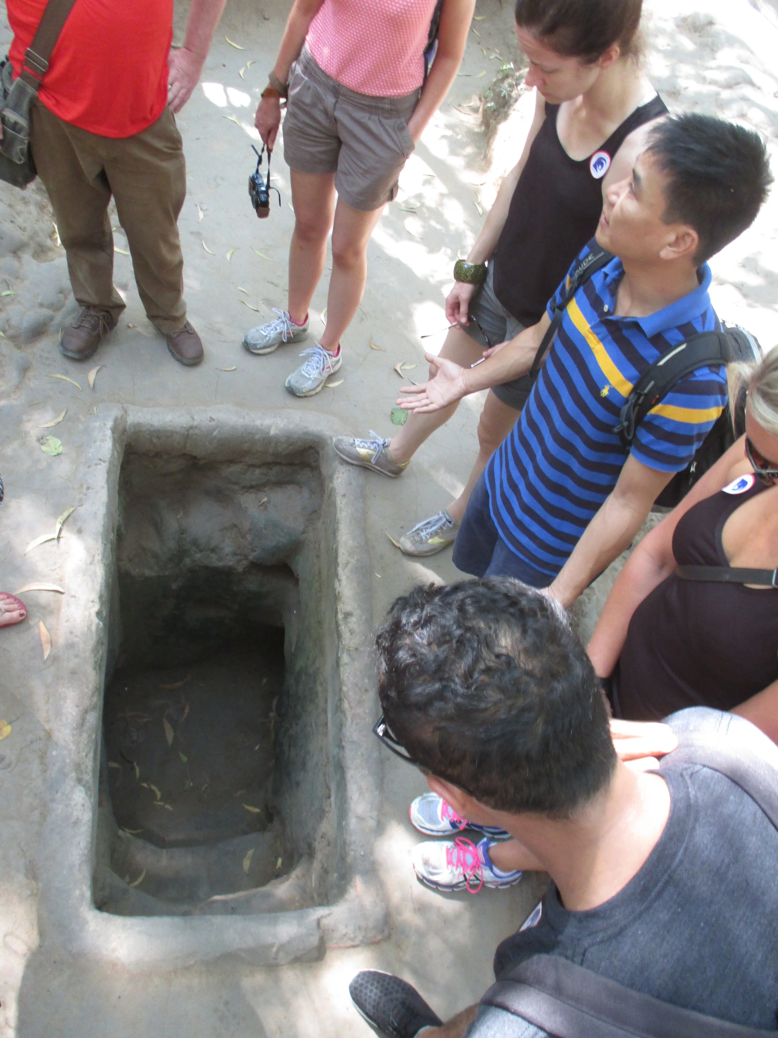 Hoang showing us an entrance to the tunnels