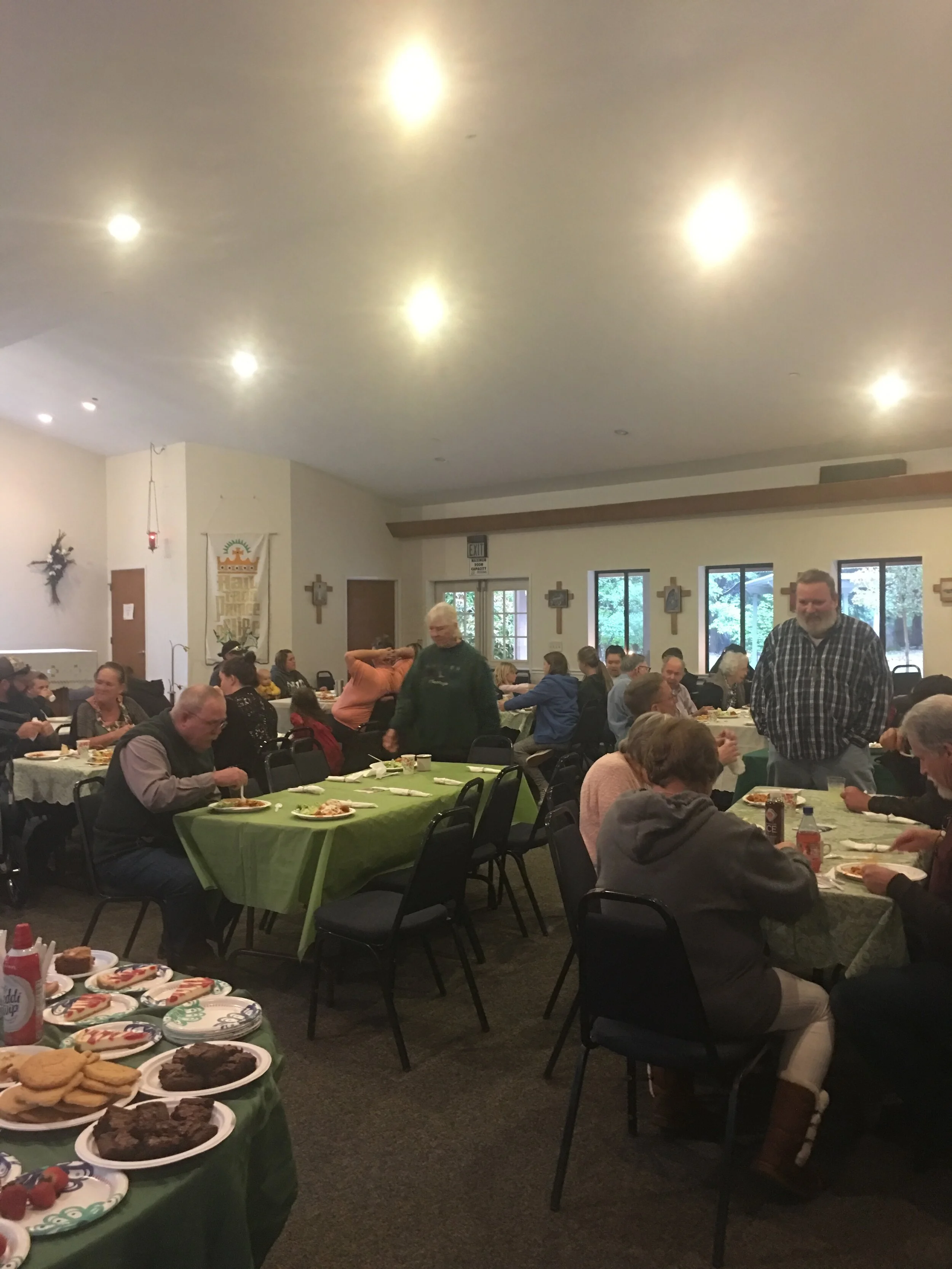 Community enjoying the delicious spaghetti dinner prepared by Becky 2019