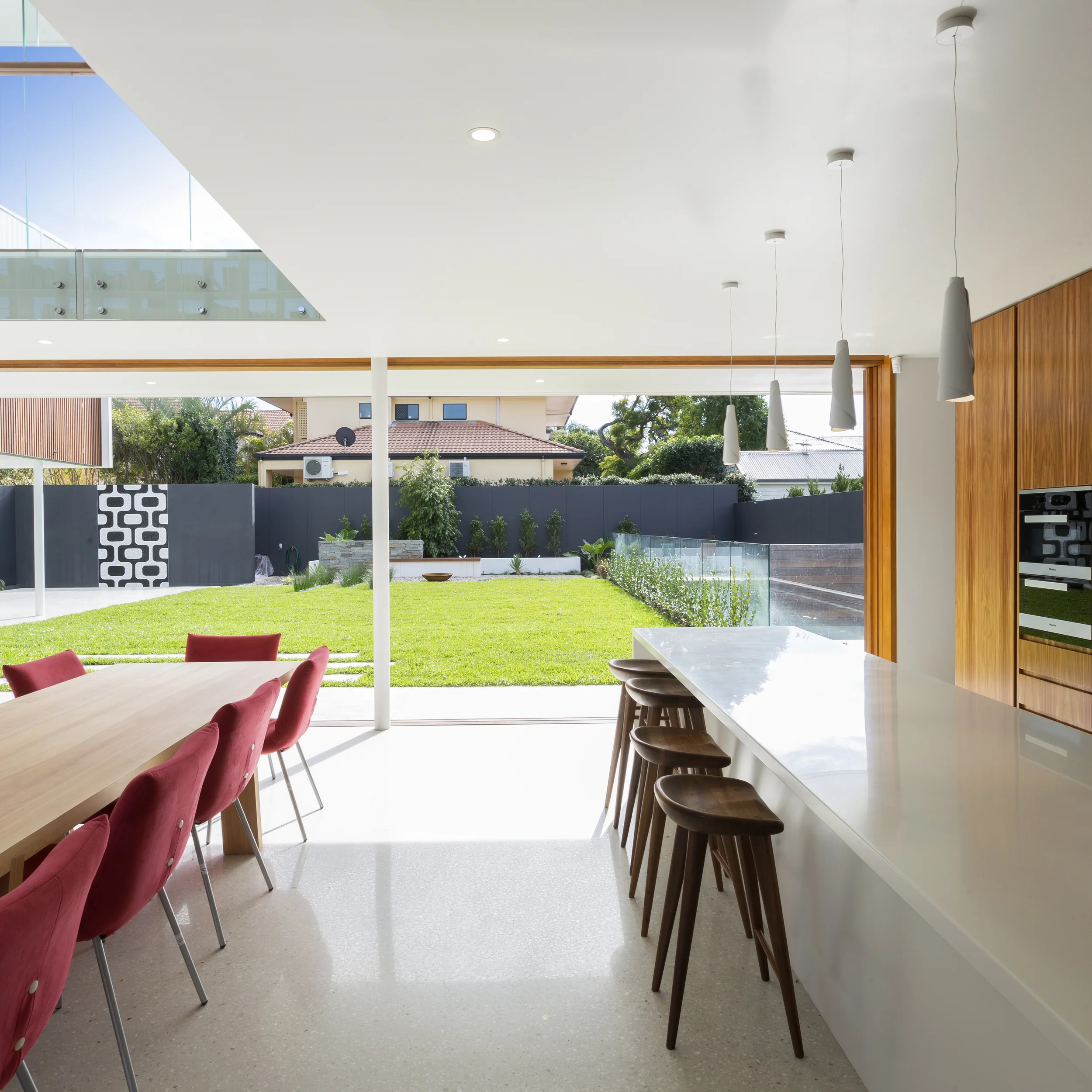  Open plan living and kitchen - architecture that transitions seamlessly into the landscape in Clayfield, Brisbane.  