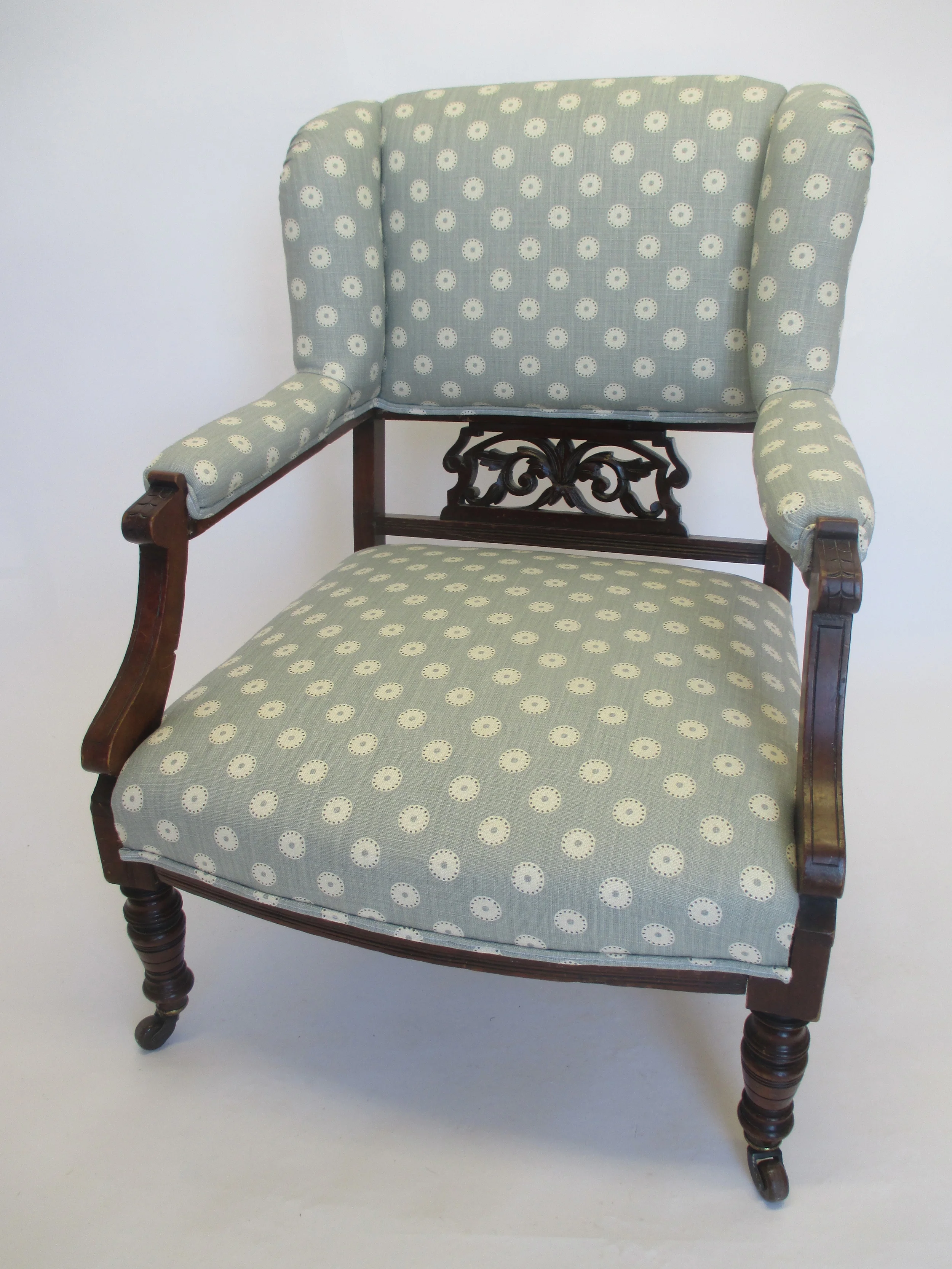 This chair is covered in 'Pretty Maids' by Vanessa Arbuthnott. The fabric is light and fresh and lifts the chair letting the detailing in the wood stand out. 