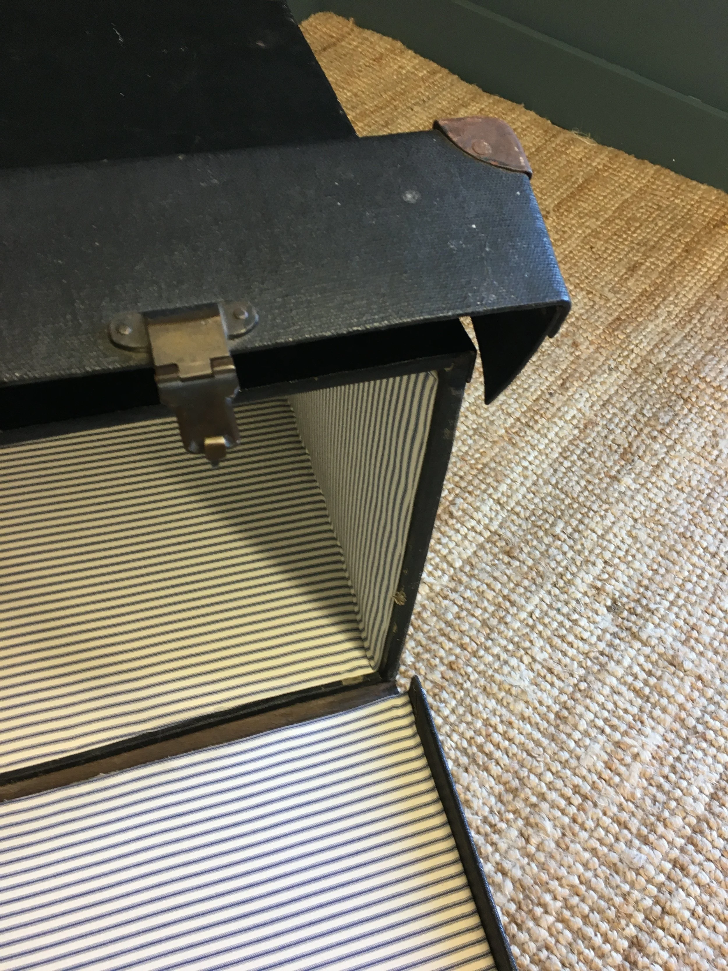 Trunk lined with ticking fabric from Ian Mankin