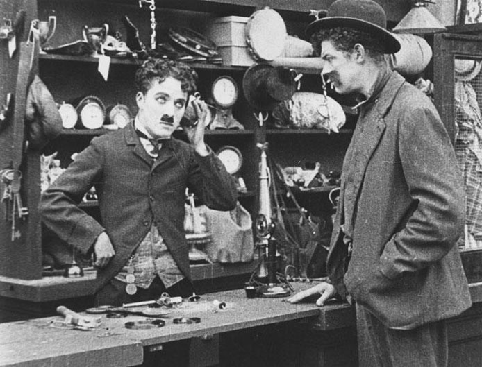 Charlie Chaplin in his pawnbroker's shop