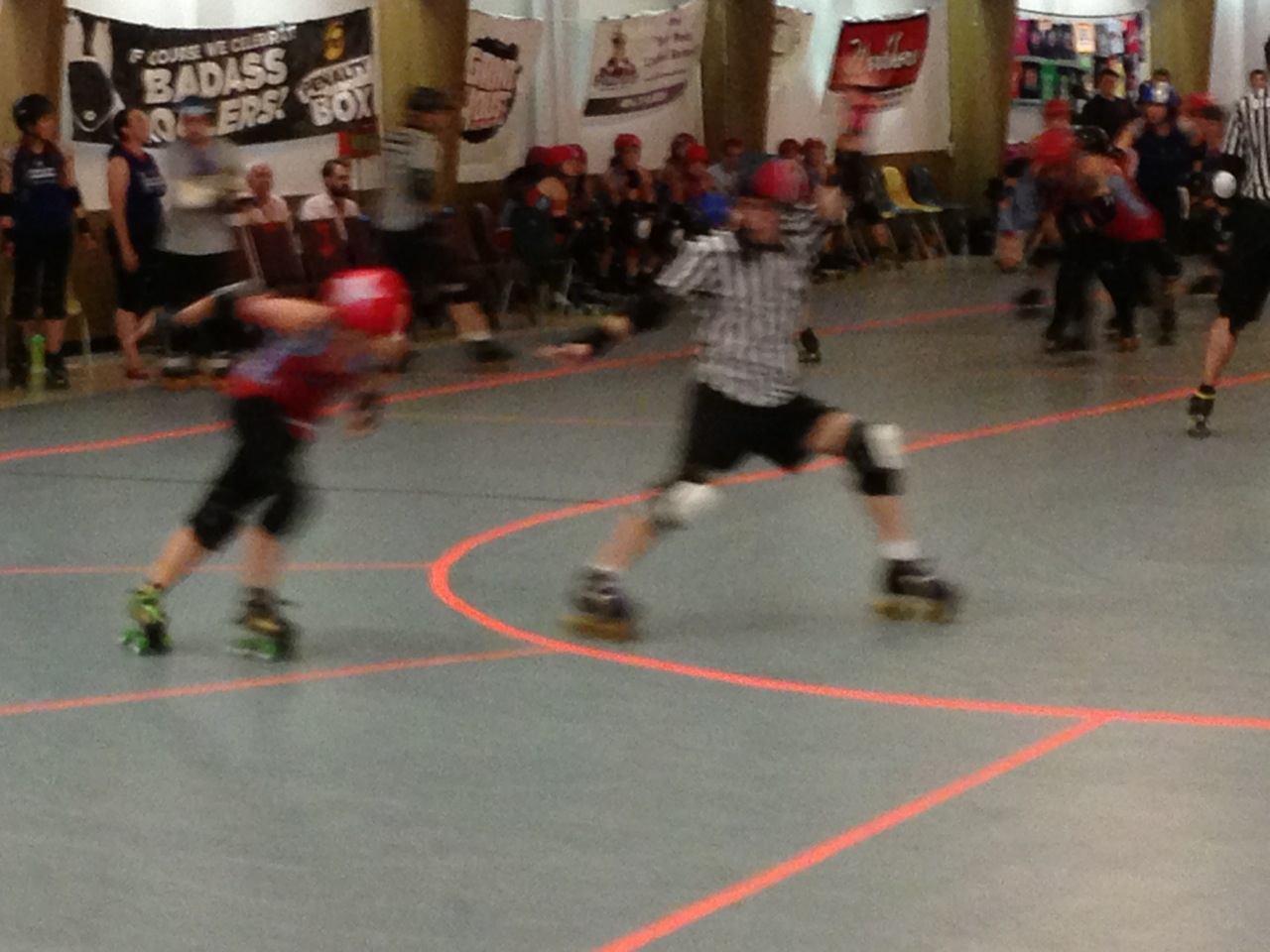 Jammer and ref roller derby