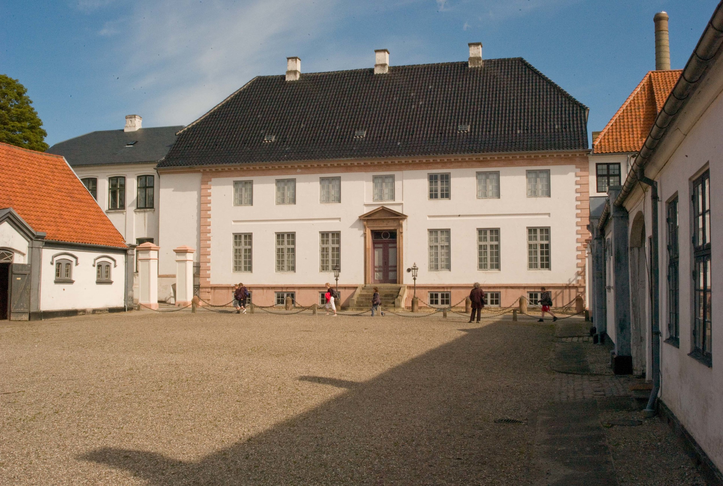 The house from the south with the stables and carriage houses flanking the forecourt