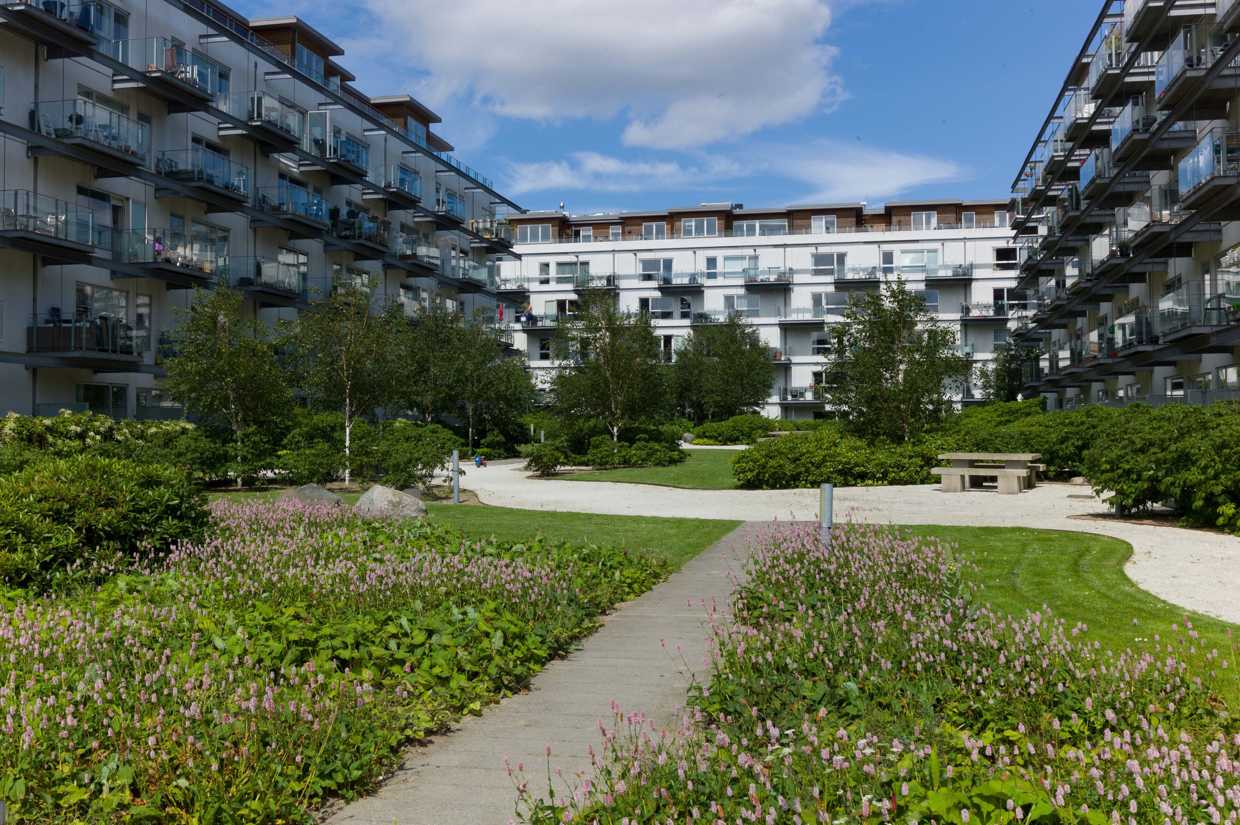   New apartment buildings at the south end of the harbour at Teglholmen. They follow a traditional form with apartments looking inwards into a large courtyard laid out with communal gardens.  