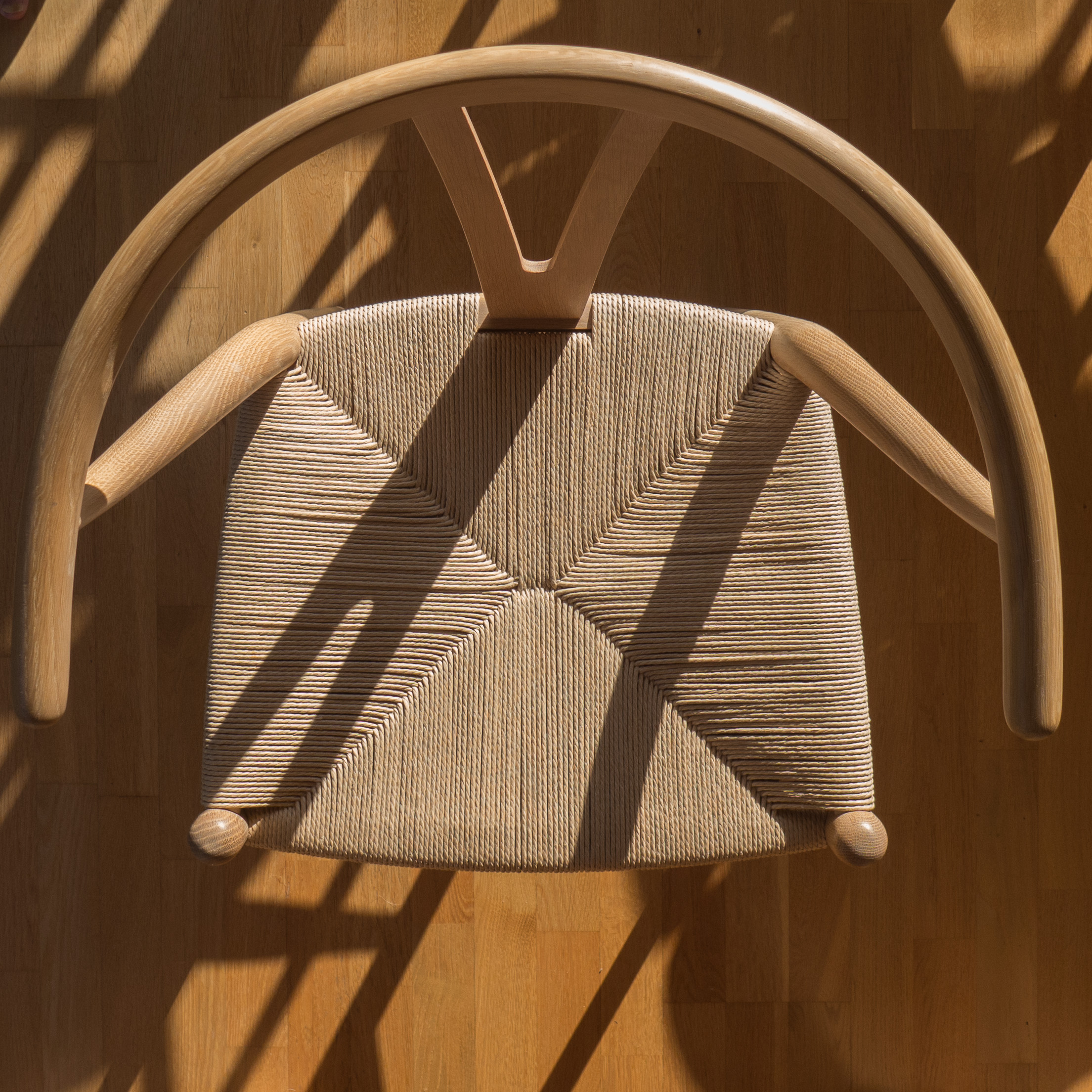 the paper cord seat of a Wishbone chair — danish architecture and design  review