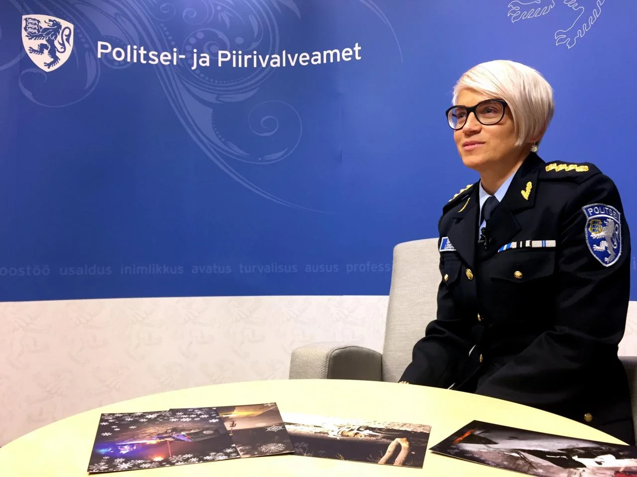 Estonian police and Border Guard Board leading public order officer Sirle Loigo shows Christmas cards to be sent to drivers with five or more driving offences recorded during the year, in Tallinn, Estonia December 22, 2017. REUTERS/Janis Laizans
