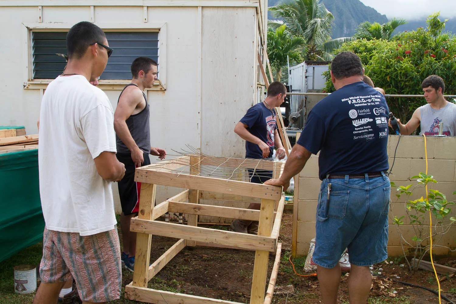 The men are working on constructing a chicken coop for the school. Eggs are expensive (along with everything else). This will help reduce the costs for the school.