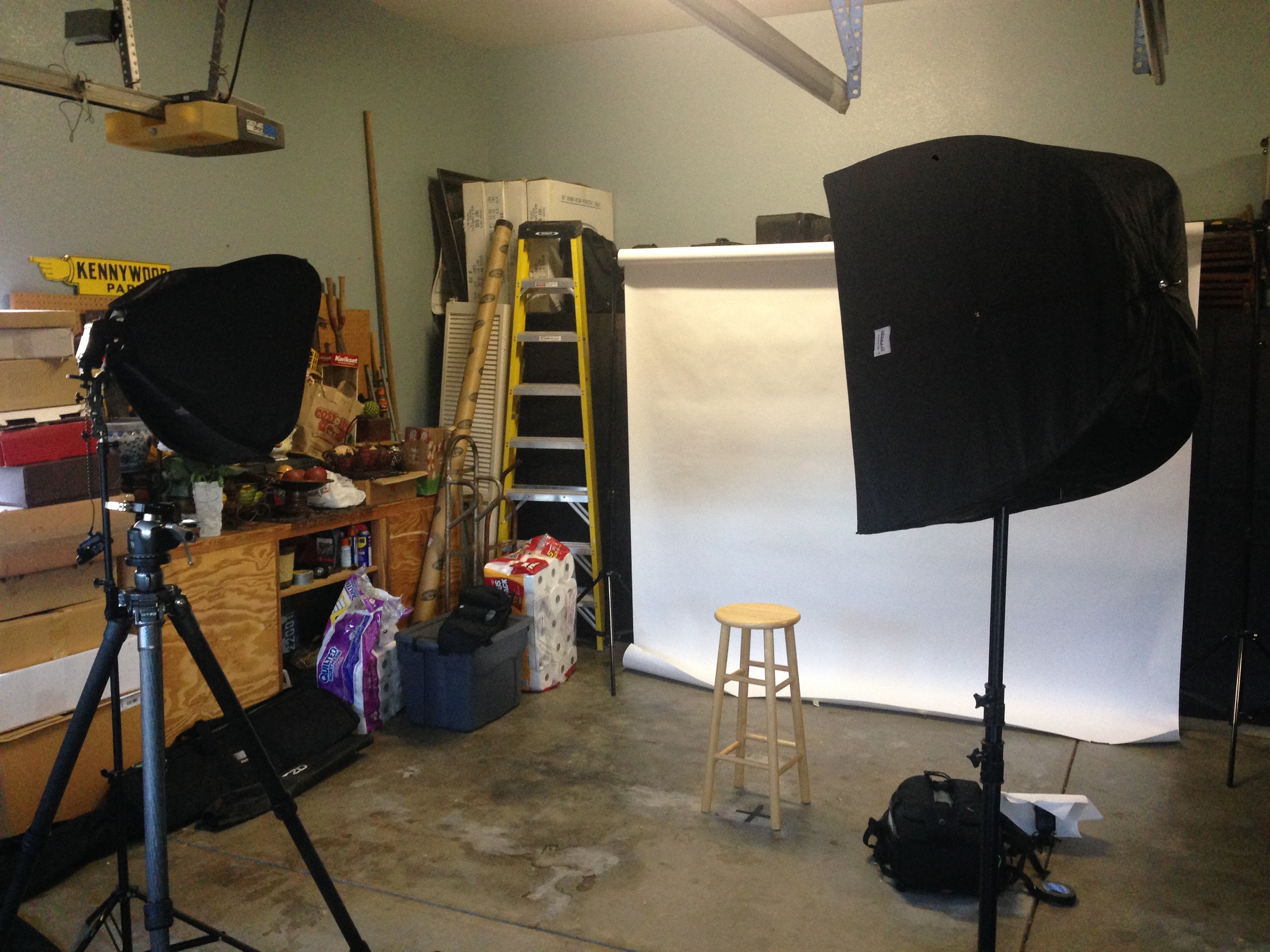Here's what the setup looked like without anybody standing in for a photo. Keep in mind that in this photo I haven't yet placed the flash behind the stool aimed at the background. You can see it all ready to go off to the right on the floor, but that's not the place where I used it.