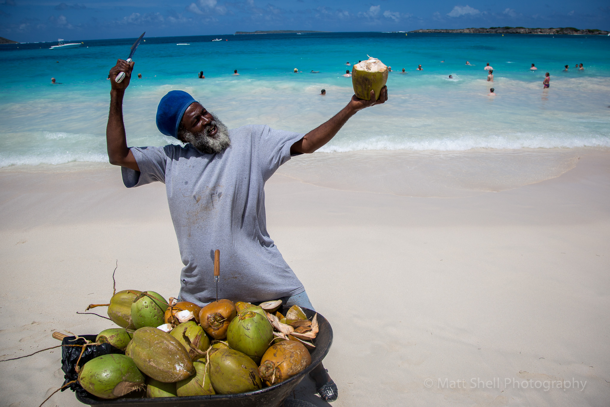 This guy was selling coconuts on the beach. When you see people like this, buy what they're selling and then ask to take their picture. They'll almost always be happy to let you snap away and may even pose a bit for you like this guy.