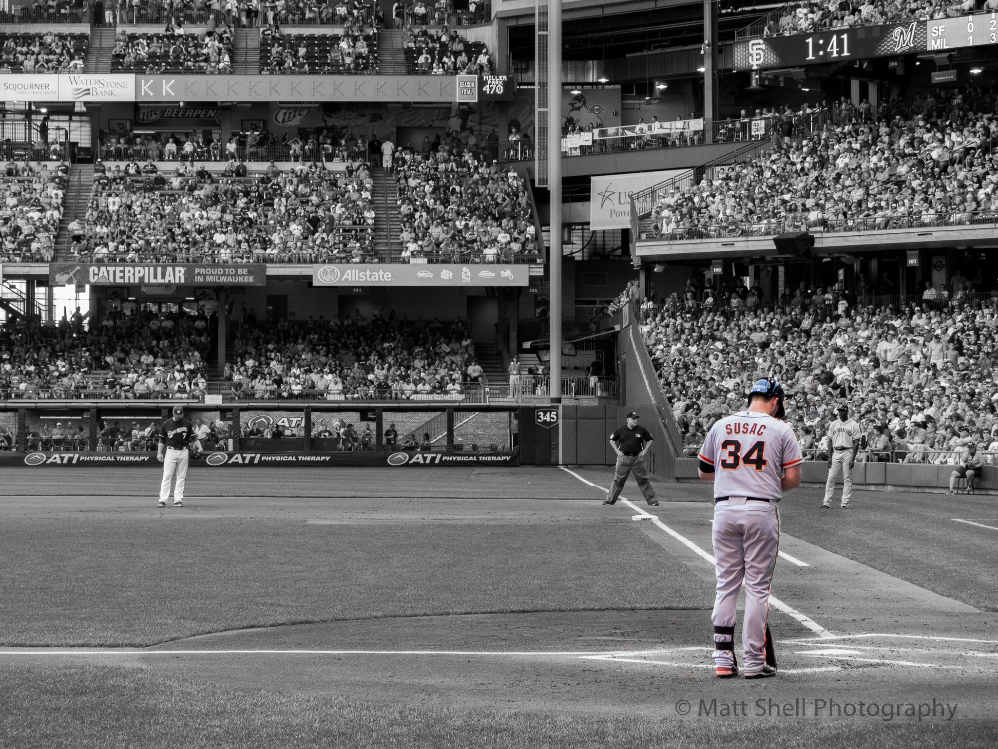 I've gotta admit, I don't usually like this kind of treatment, where a black and white image has only one part of it in color, but I think it works in this image and focuses the viewer on the iconic orange and black of Susac's uniform.