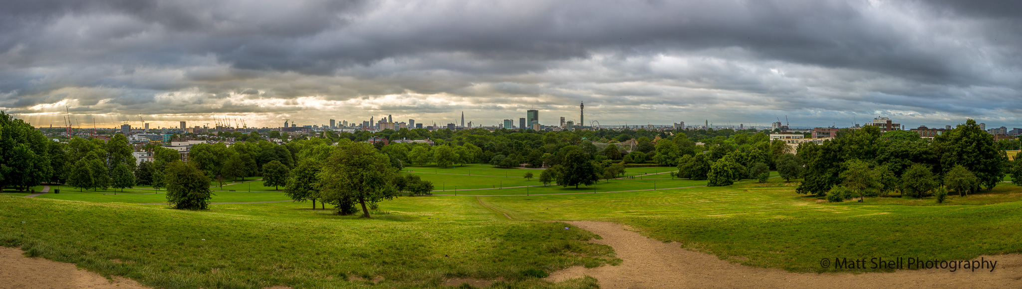 This is the view from standing at the top of the hill, facing central London across the river. If you look carefully toward the right of center, you can see the London Eye.