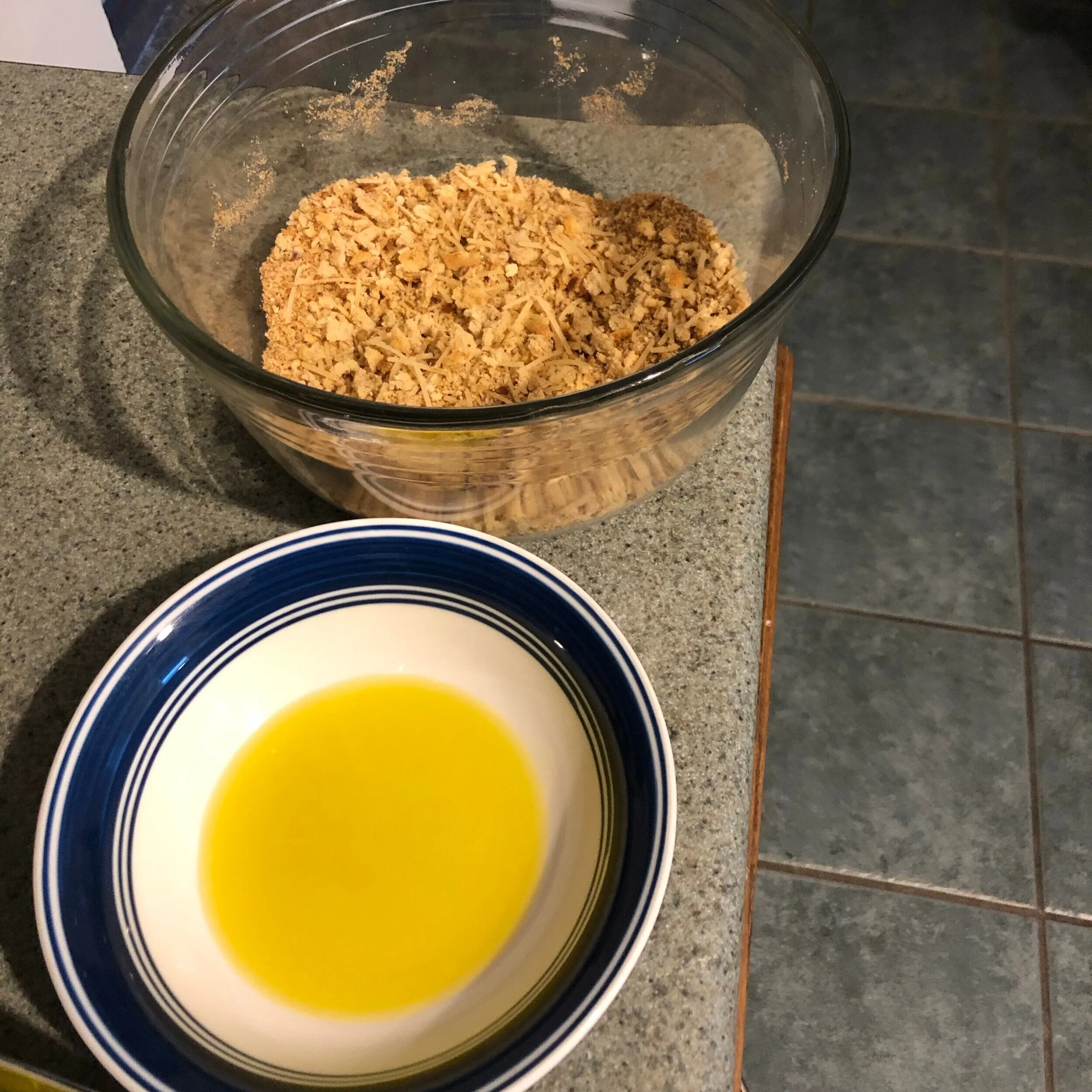  Step 2: Mix breadcrumbs, spices, and cheese in one bowl. Put olive oil in a separate bowl. 