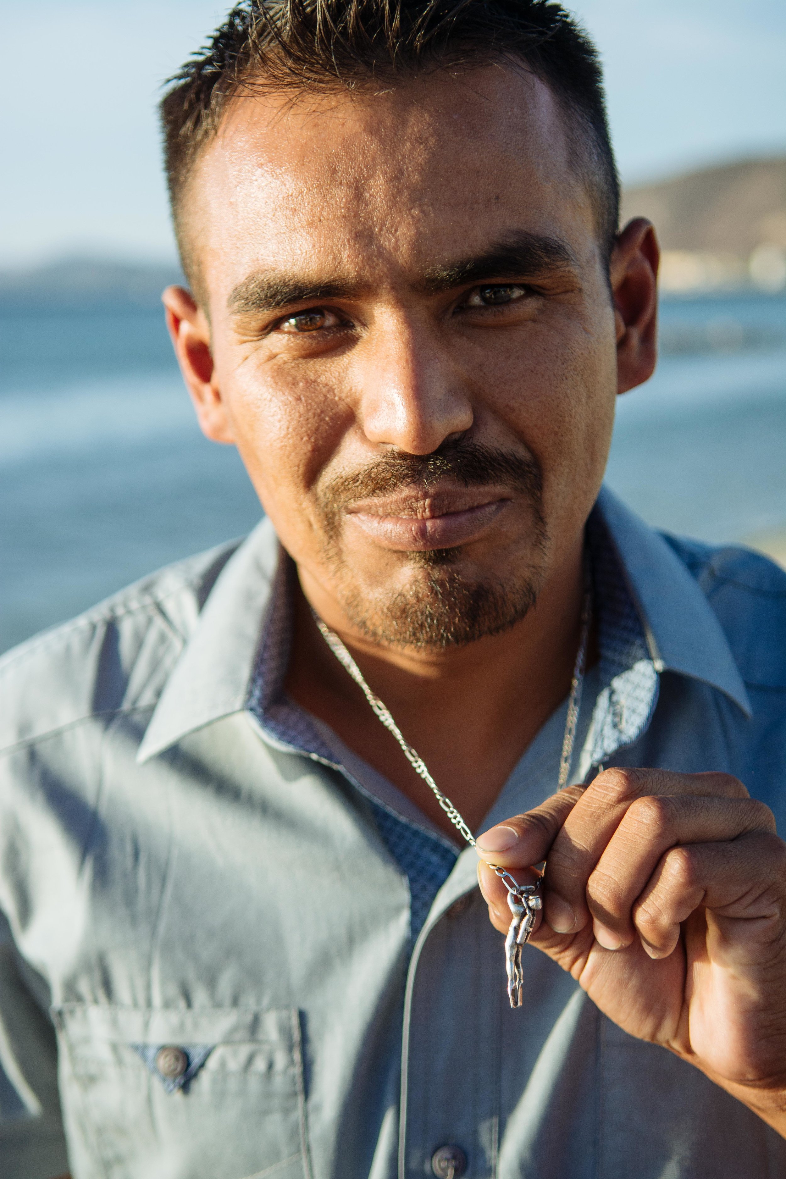 Scuba diving is Rey's favorite thing in the world, and he shows his diver necklace that he wears with him everywhere. Diving to fish is dangerous, most diver-fishermen have very personal stories of loss of friends or family.