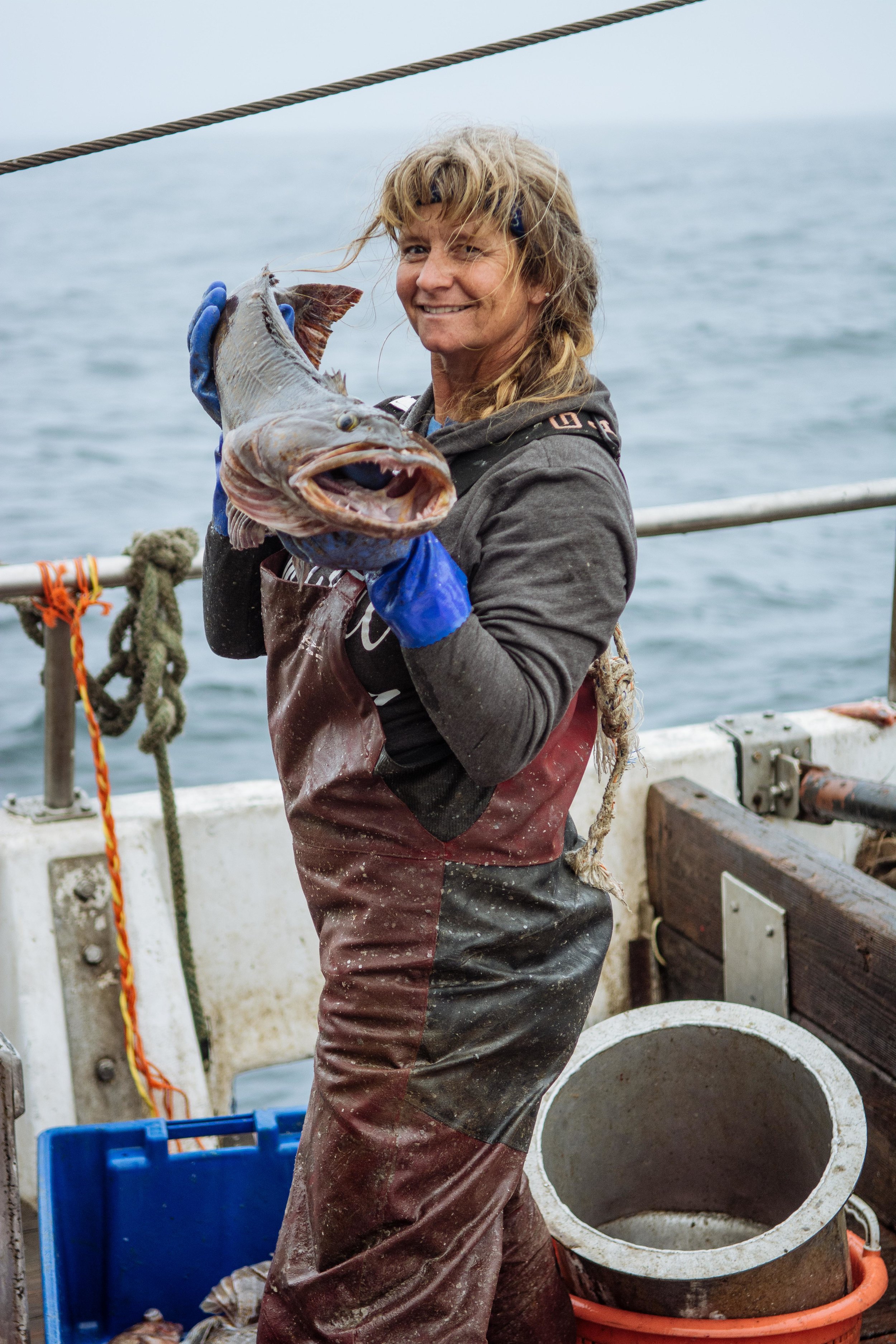 Joleen shows off a large Ling Cod