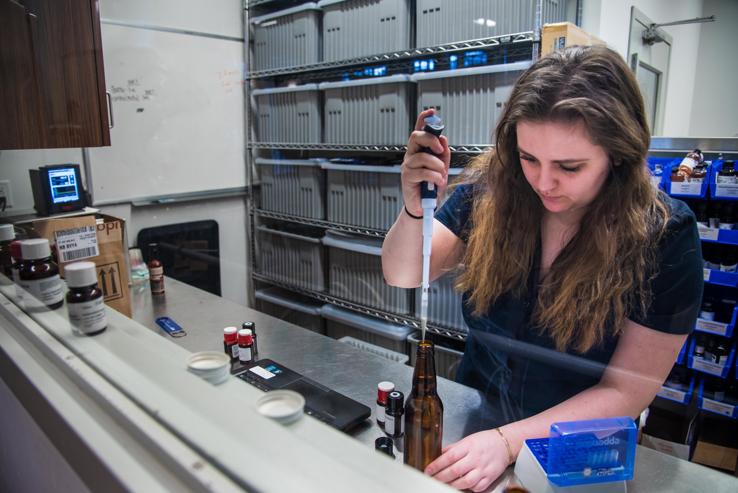 Rebeca Conway, Psychology ’20, tests flavors in various beers as part of her co-op in the sensory lab.