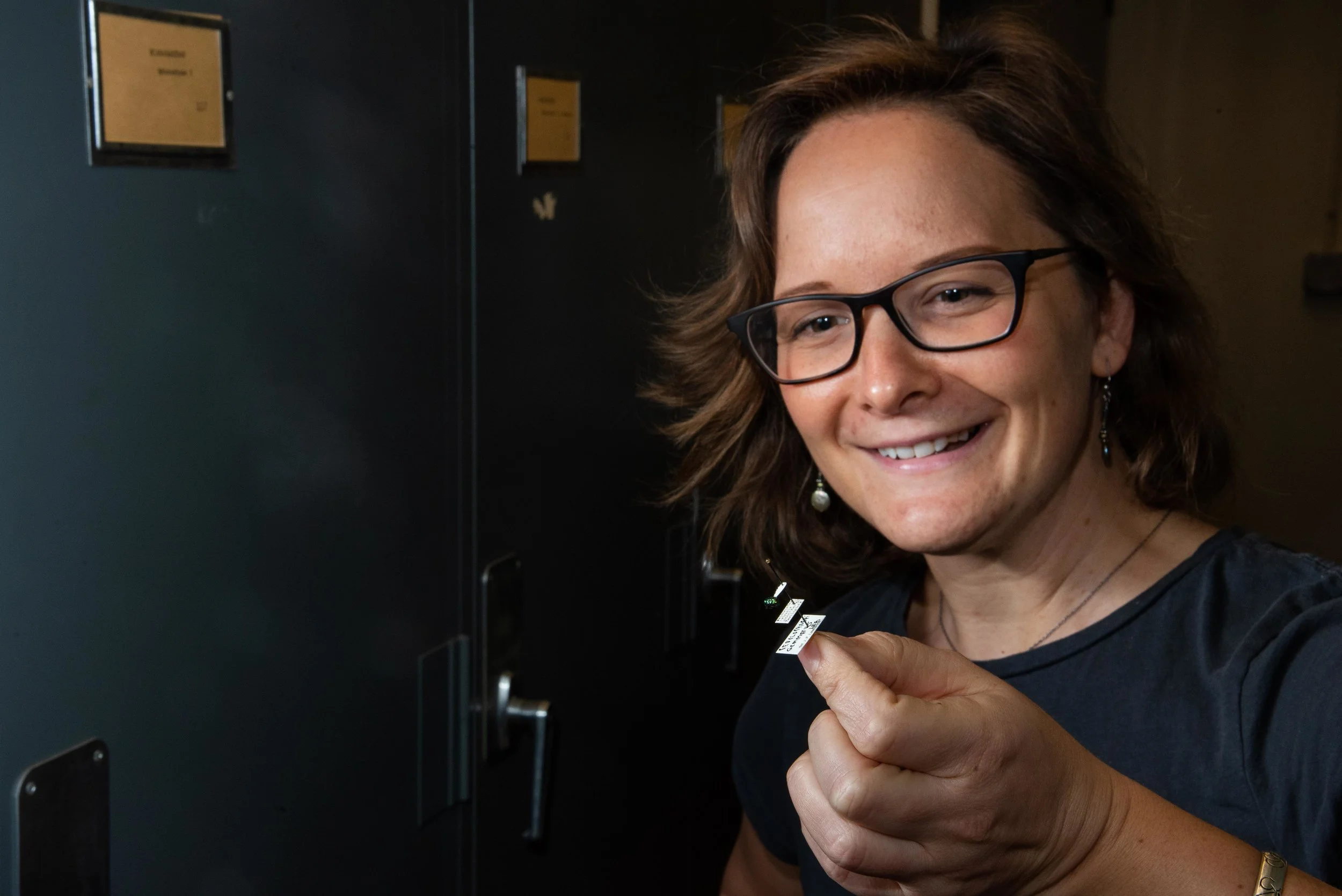 Crystal Maier and her favorite specimen, a Christmas Ornament Beetle.