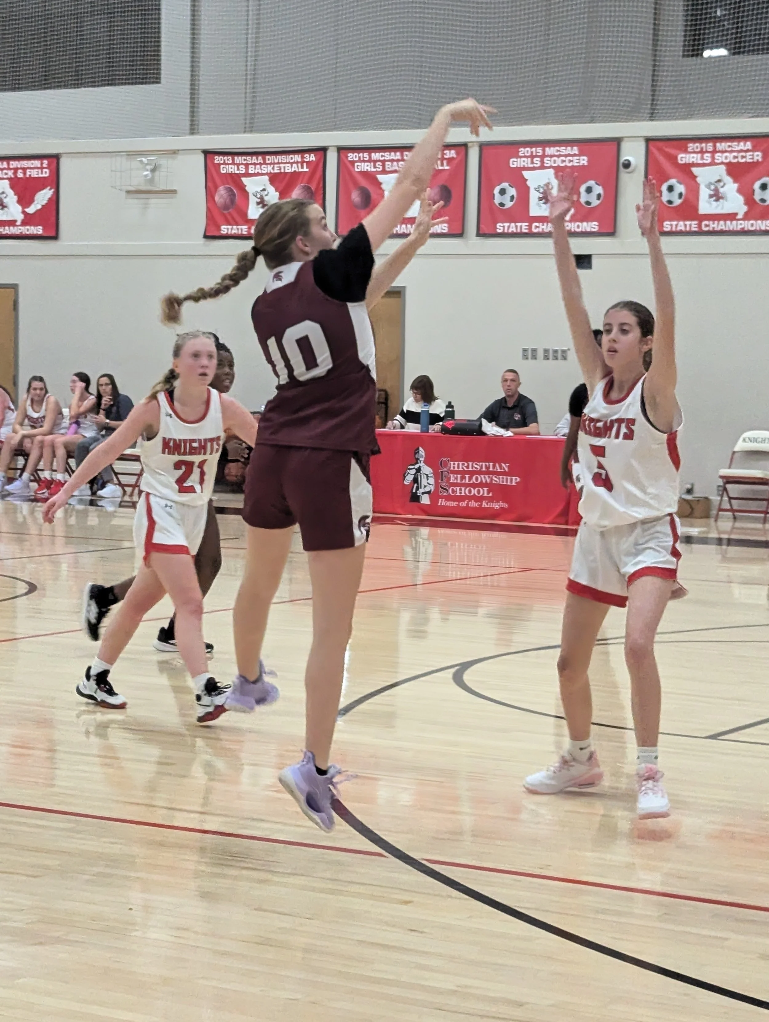 Girl shooting a basketball
