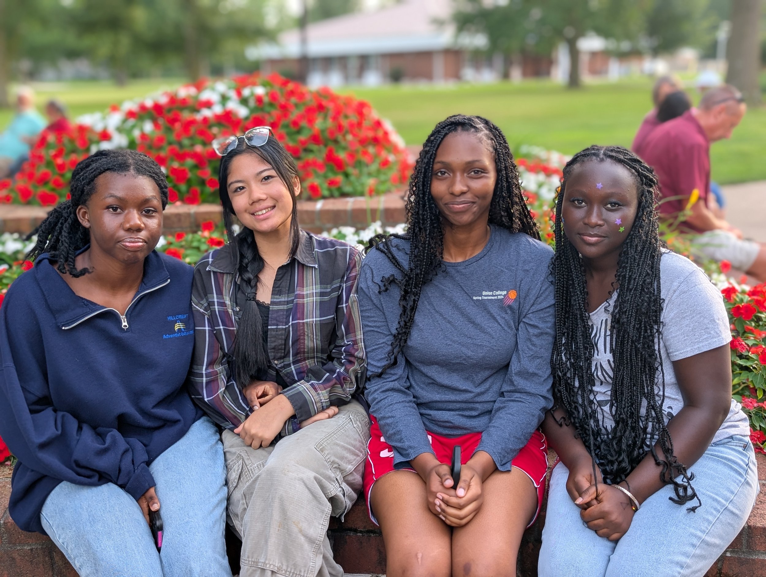 Four girls smiling for the camera
