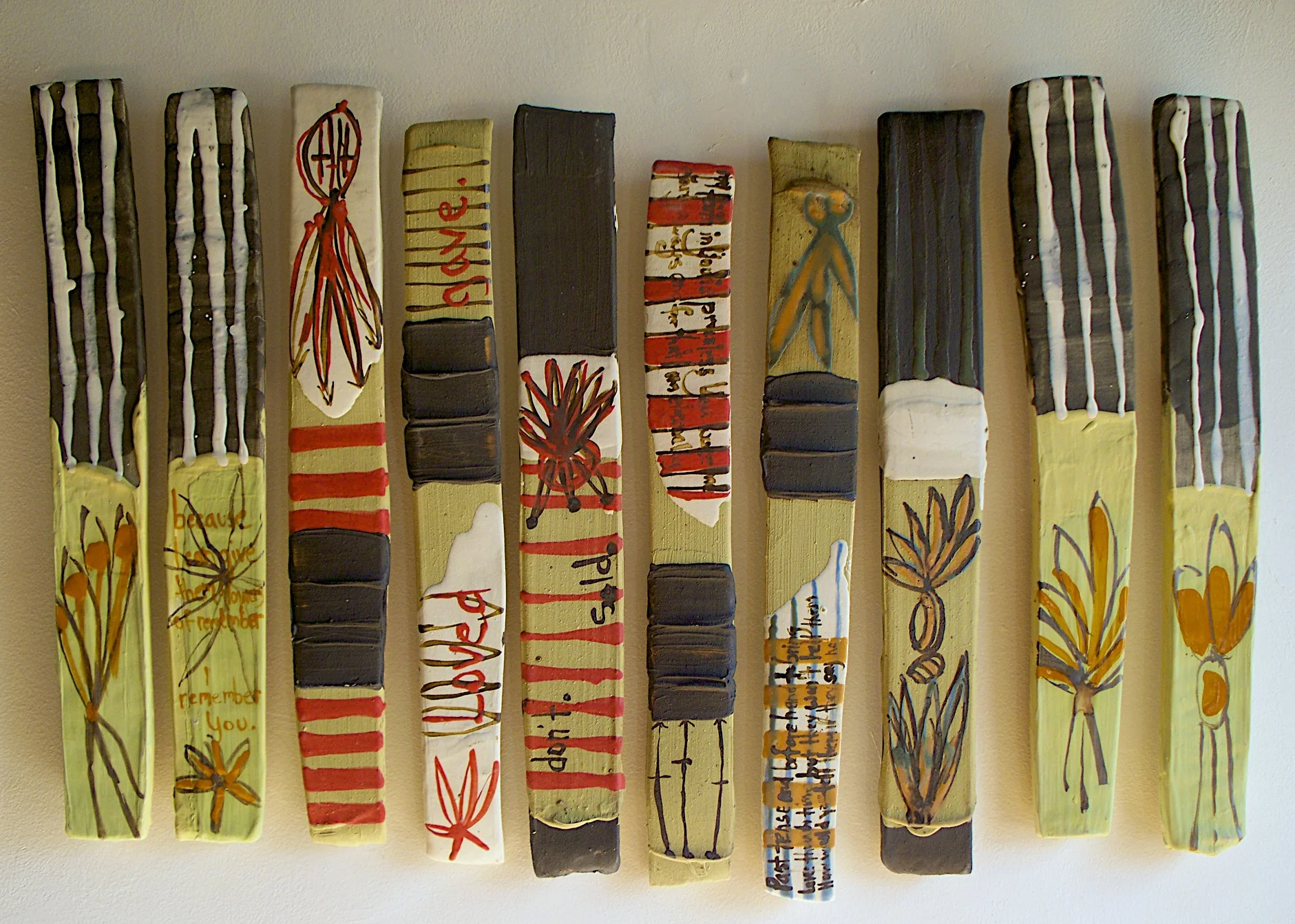Strip Piece Tiles: 'they understood the psalmist', 38” x 16” (dimensions variable), stoneware, black clay, colored slip, glaze, 2008