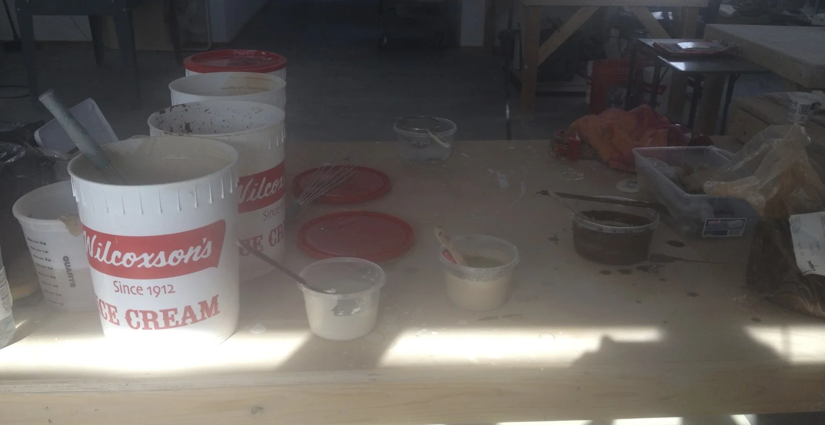 ....buckets of slip used to coat the tiles......