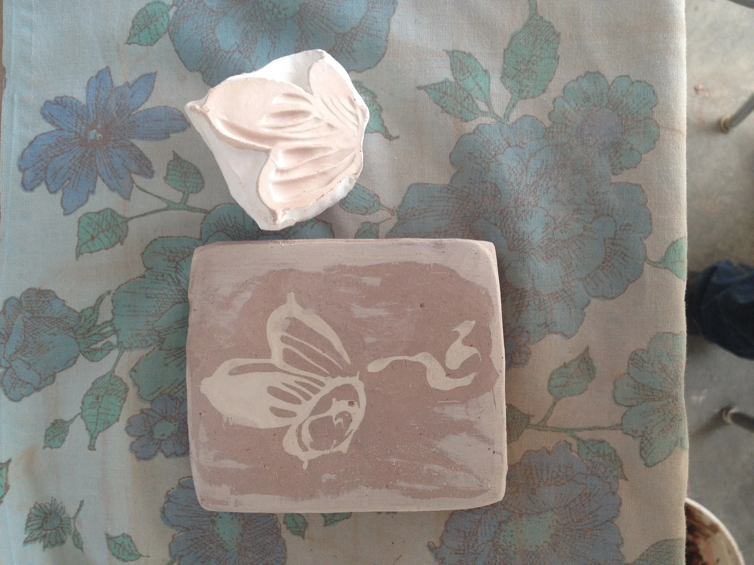  here is a plaster stamp I made of one of the block prints I had made in India....in addition to printing on paper, I am using them as stamps for clay... 