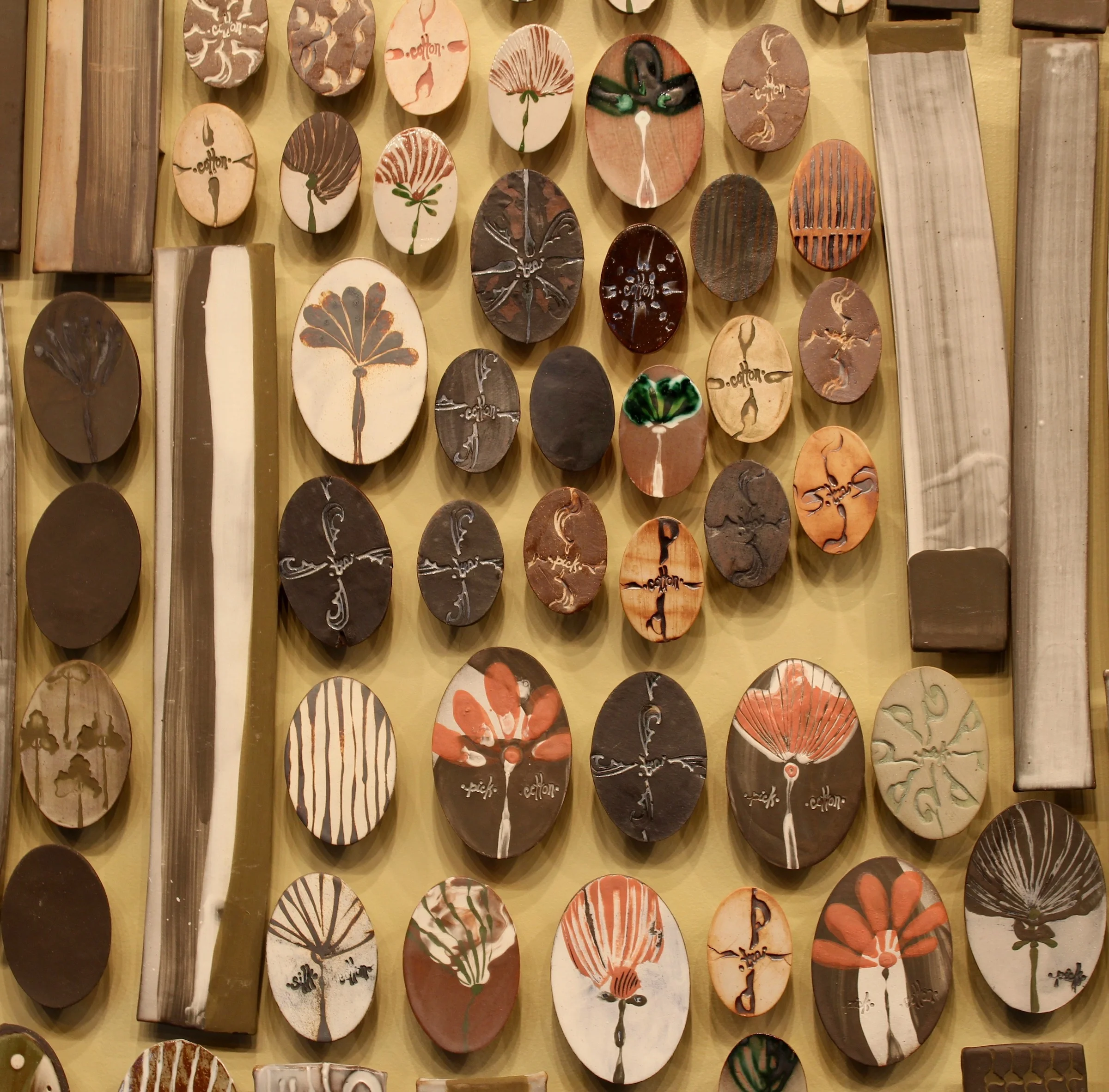 Detail - Coded Memory Quilt: ‘for Tuktuki and Matu, our time together in Jorhat, Assam’, Stoneware, Porcelain, Black Clay Slip, Cone 04 Oxidation, Cone 6 Oxidation, Cone 10 Reduction, 6’ x 5’.8” x 1.5” (dimensions variable), 2018 Chotsani Elaine Dean