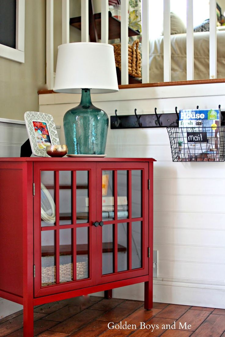 This cute cabinet was restyled by Courtney over at 'Golden Boys and Me' - see more here .