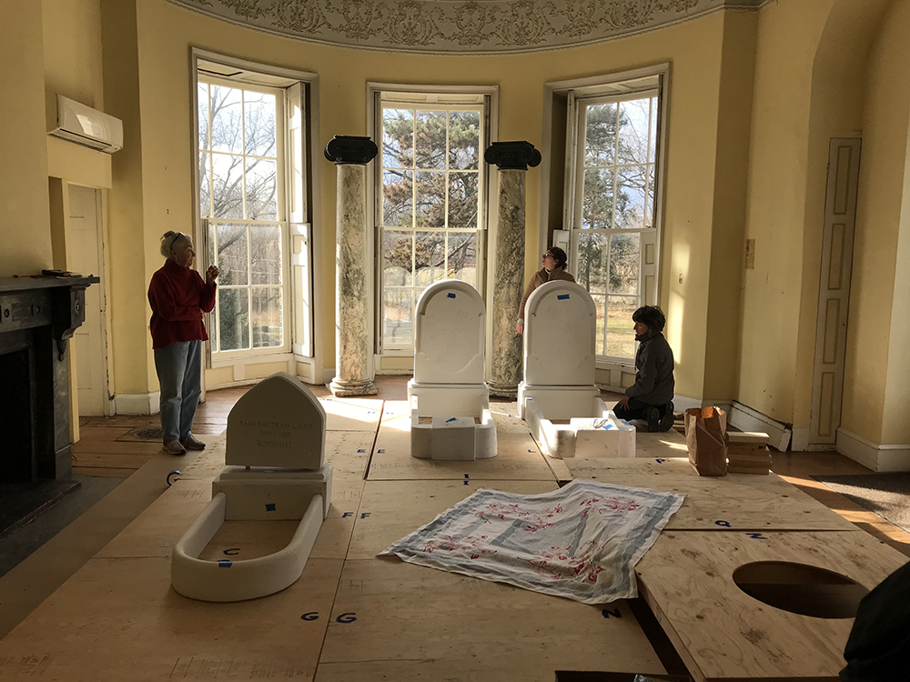 Grave Gardener Peggy Daniel oversees the layout of the family lot in the dining room of the historic Hamilton Mansion.