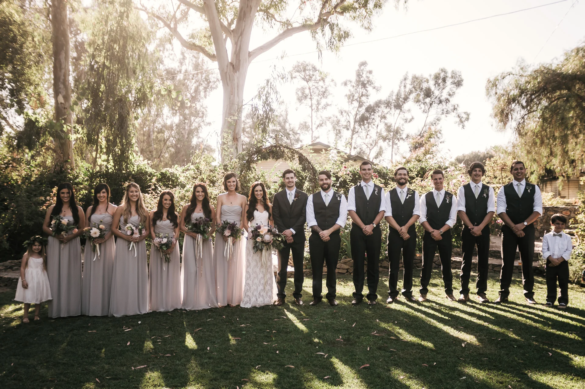 Bridal party lines up at sunset