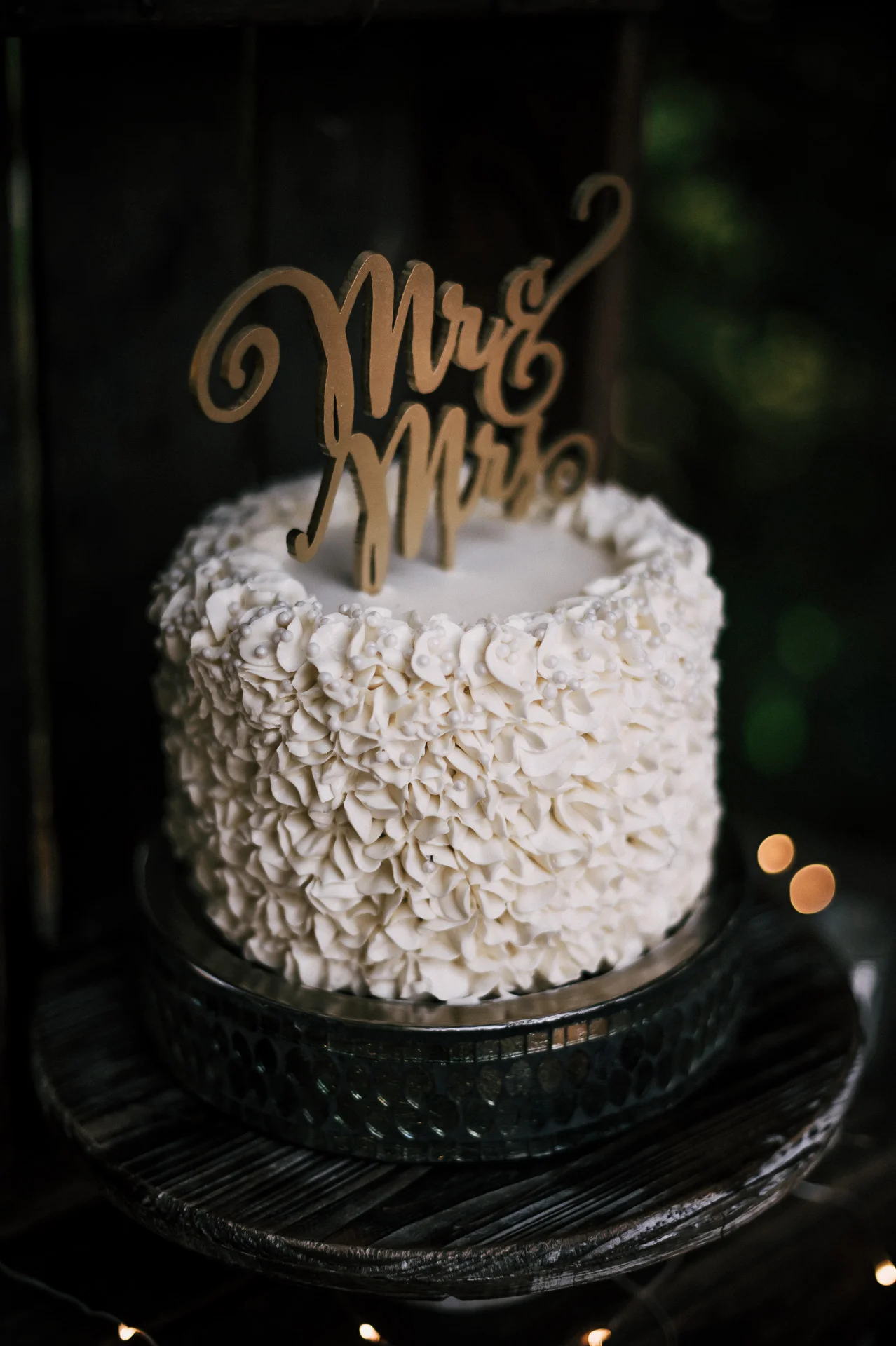 Simple but cute wedding cake with gold topper