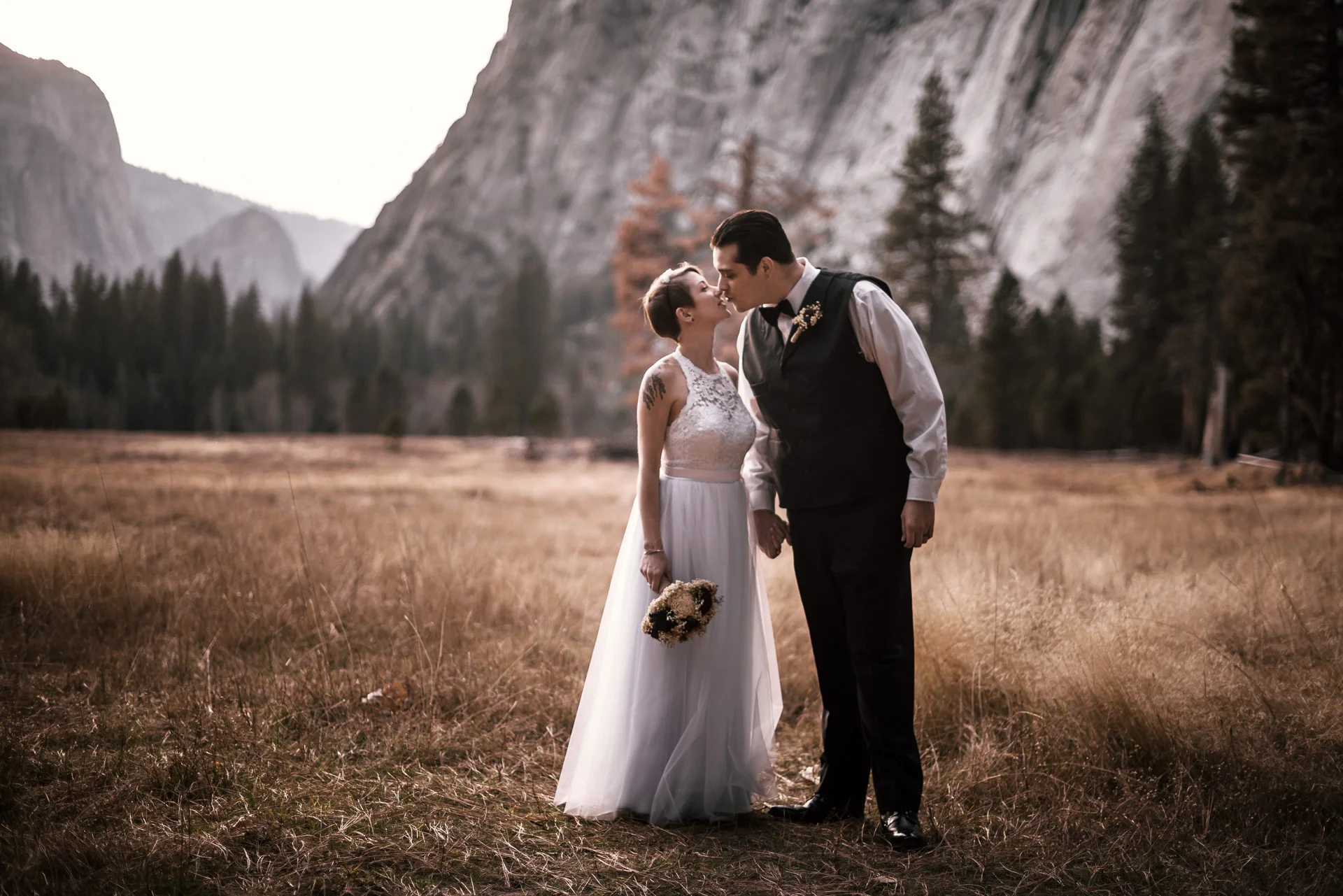 Bride and groom kiss after yosemite elopement