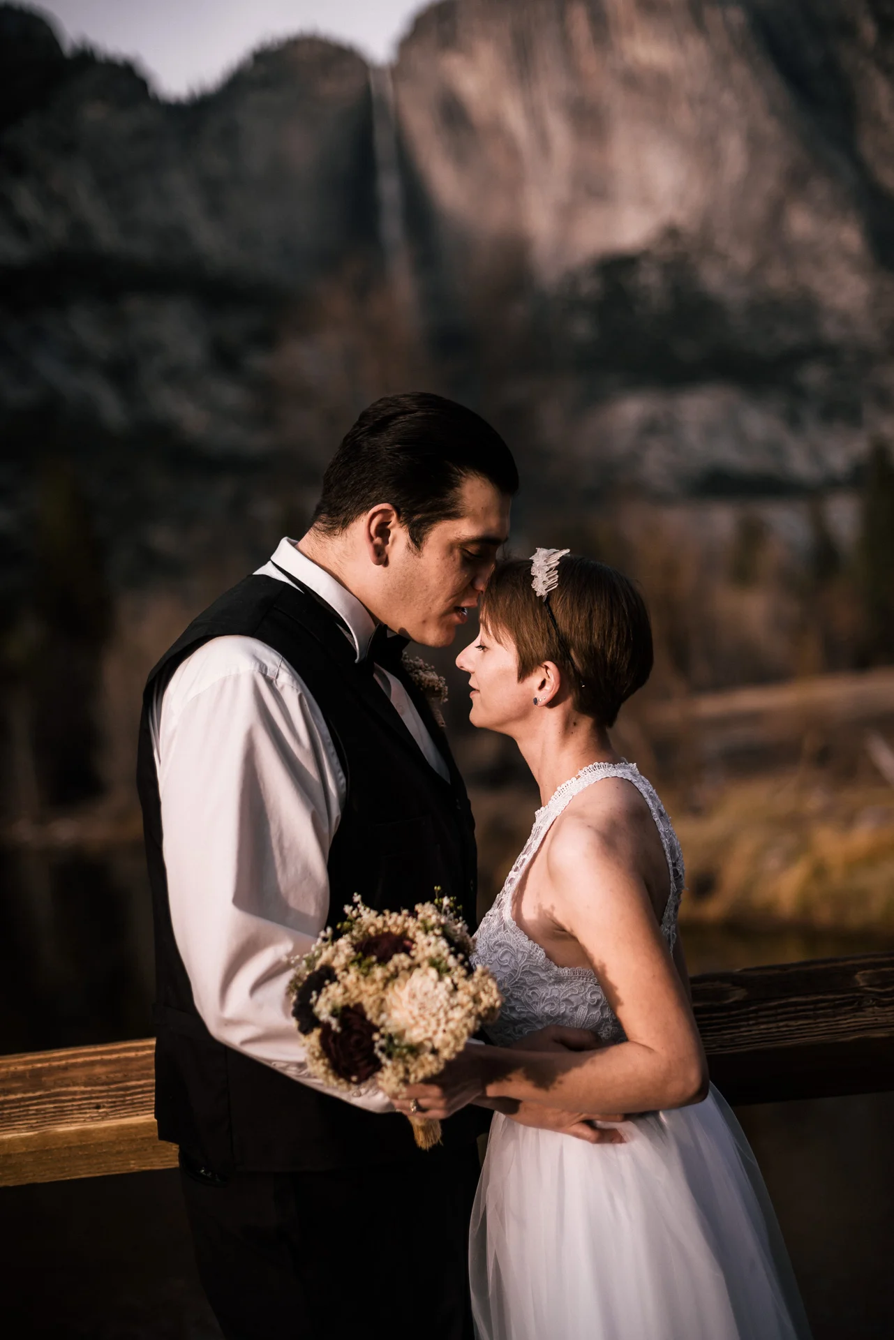 couple elopes to yosemite for romantic wedding photos at swinging bridge