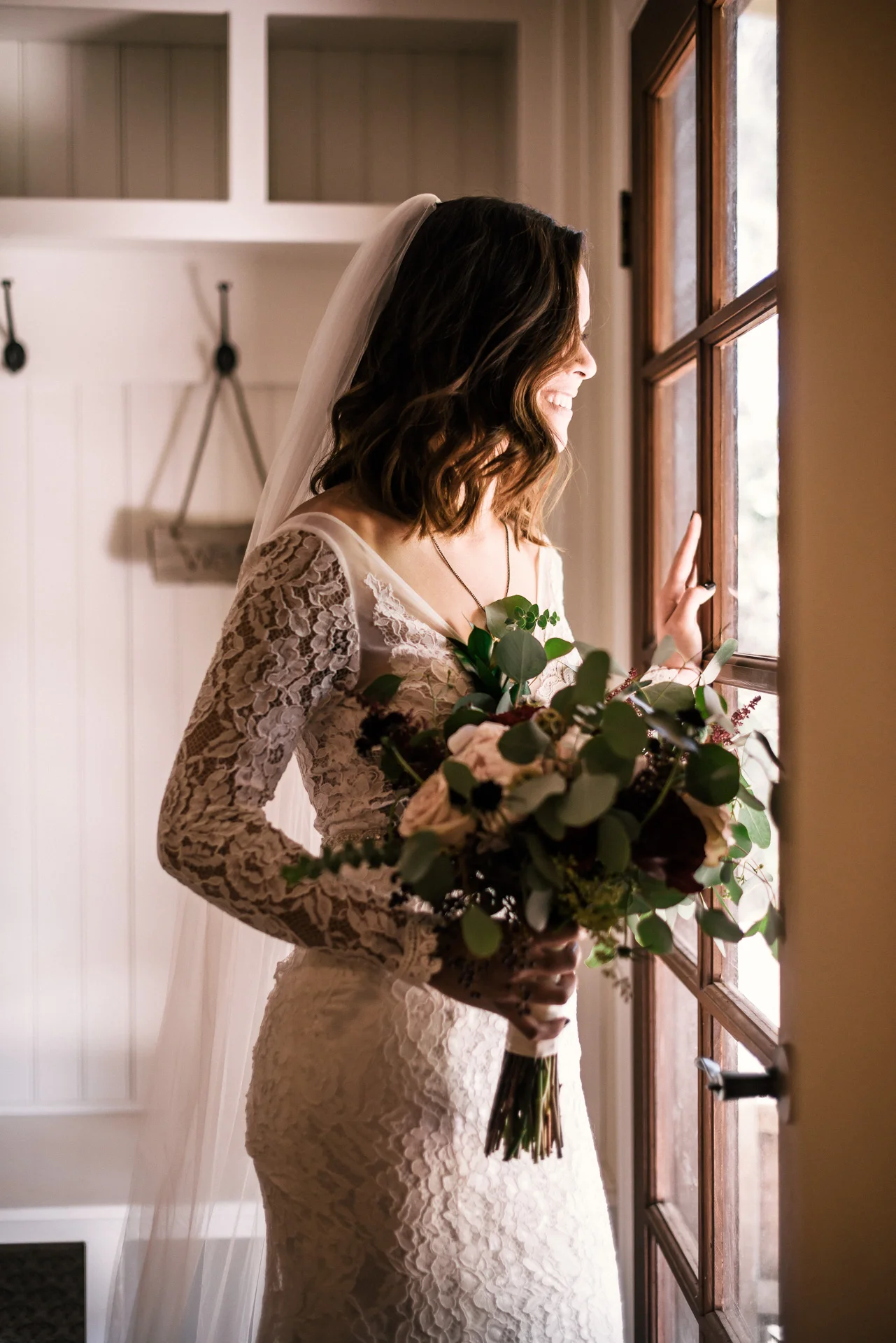 vintage bride looks out window rustic pymm ranch wedding venue winchester california