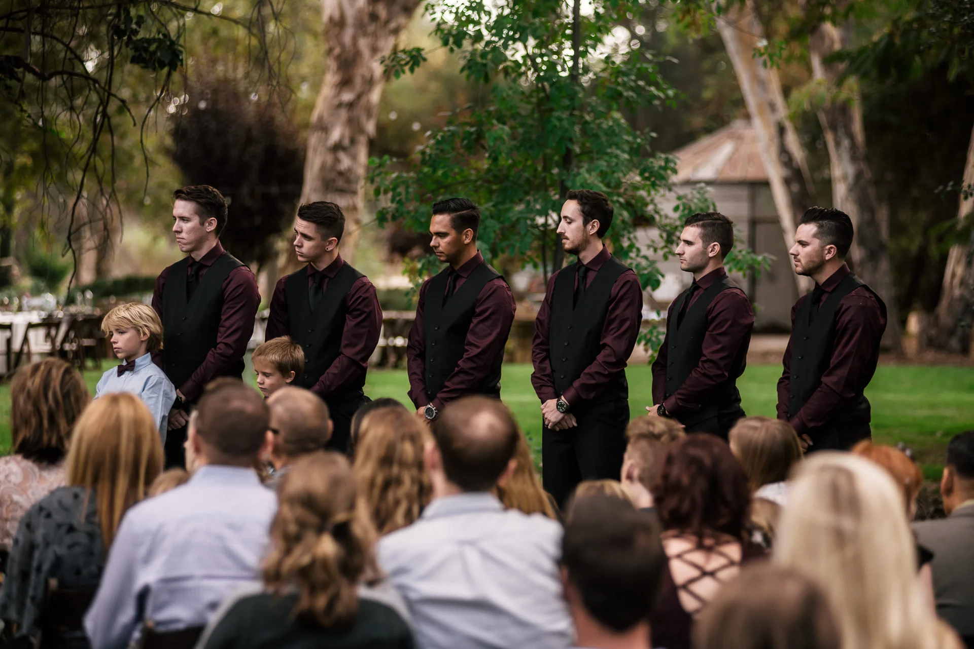 groomsmen watch on at rustic pymm ranch wedding venue in winchester california