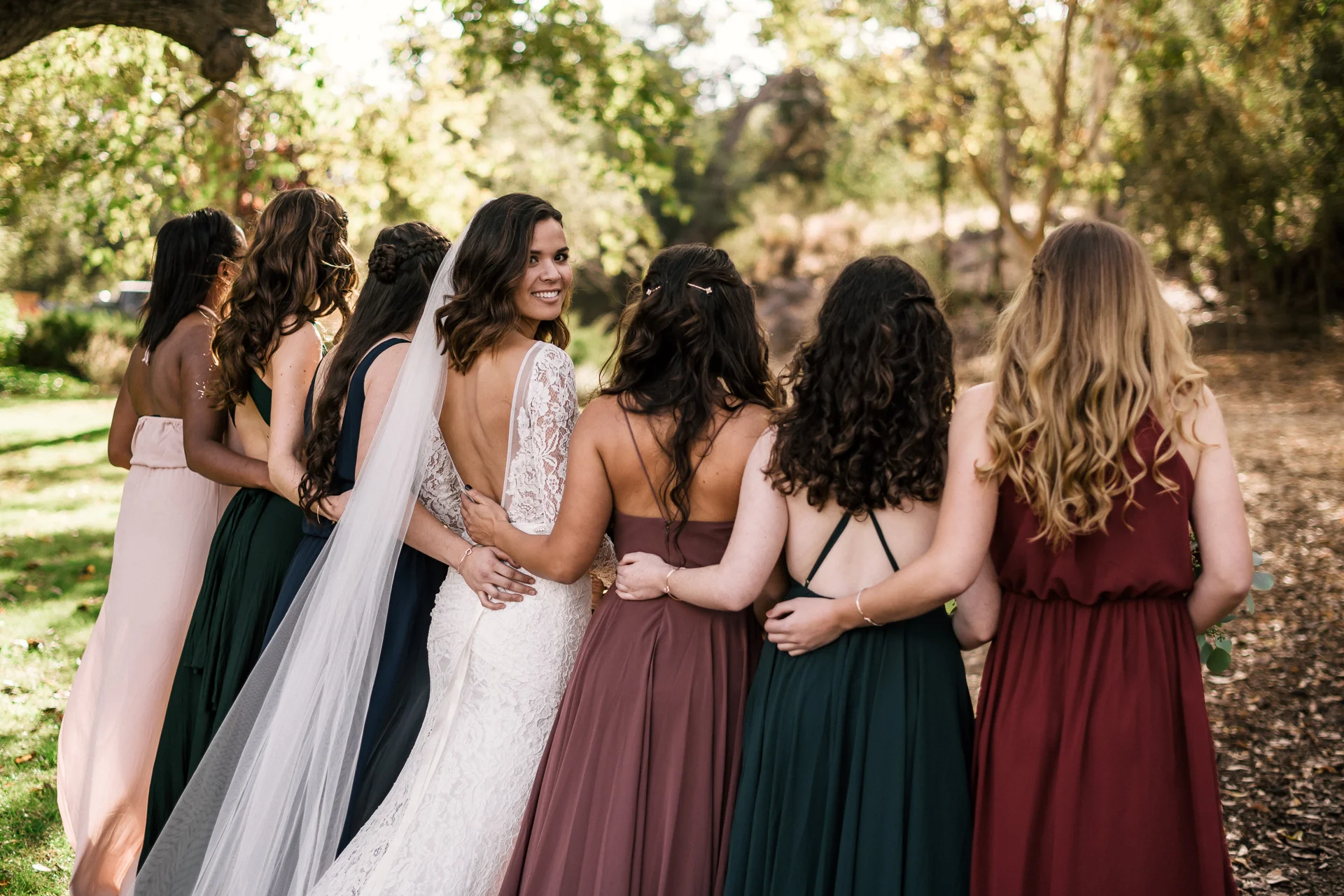 bridal party poses at rustic pymm ranch wedding venue in winchester california