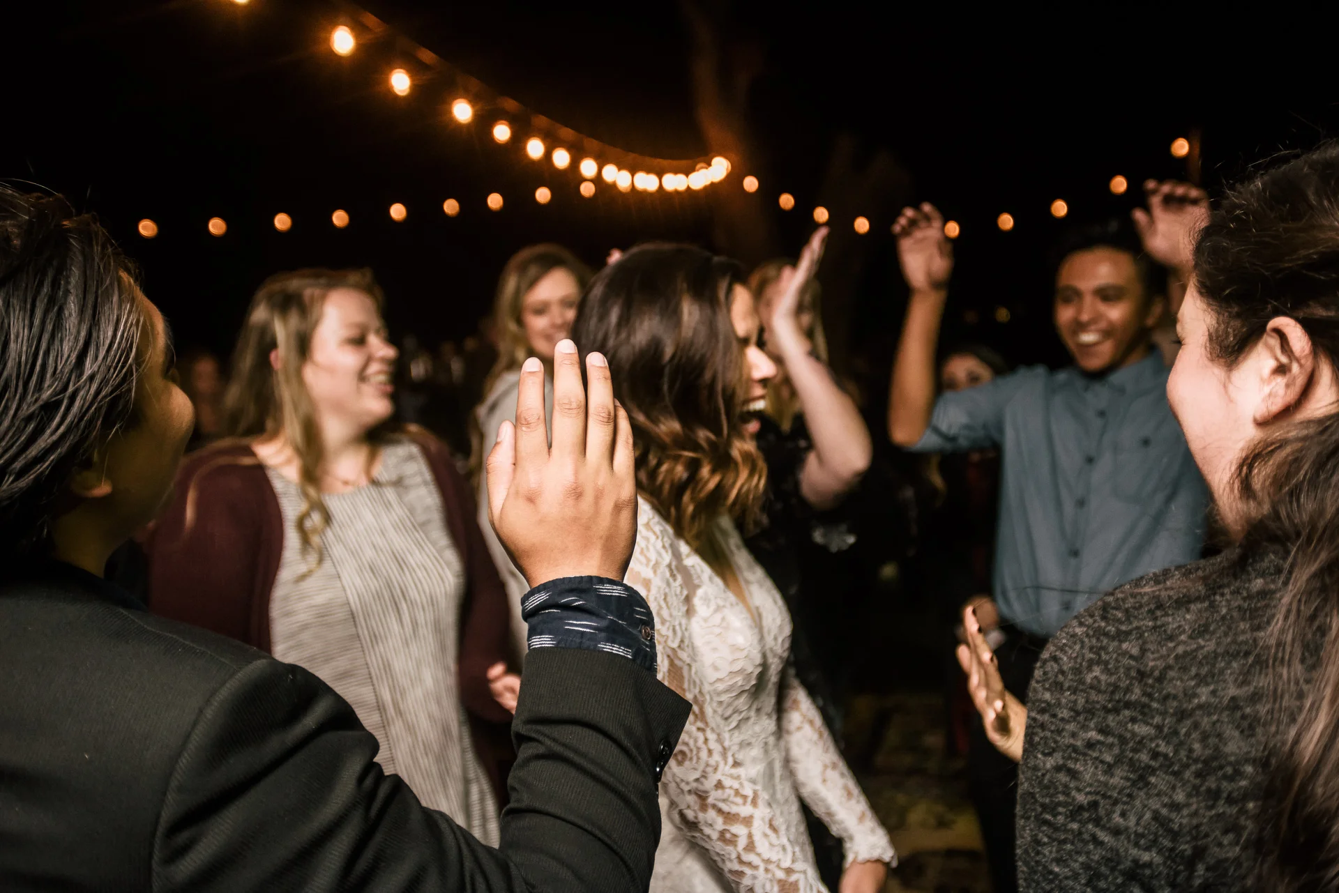 bride dances with guests at rustic pymm ranch wedding venue in winchester california