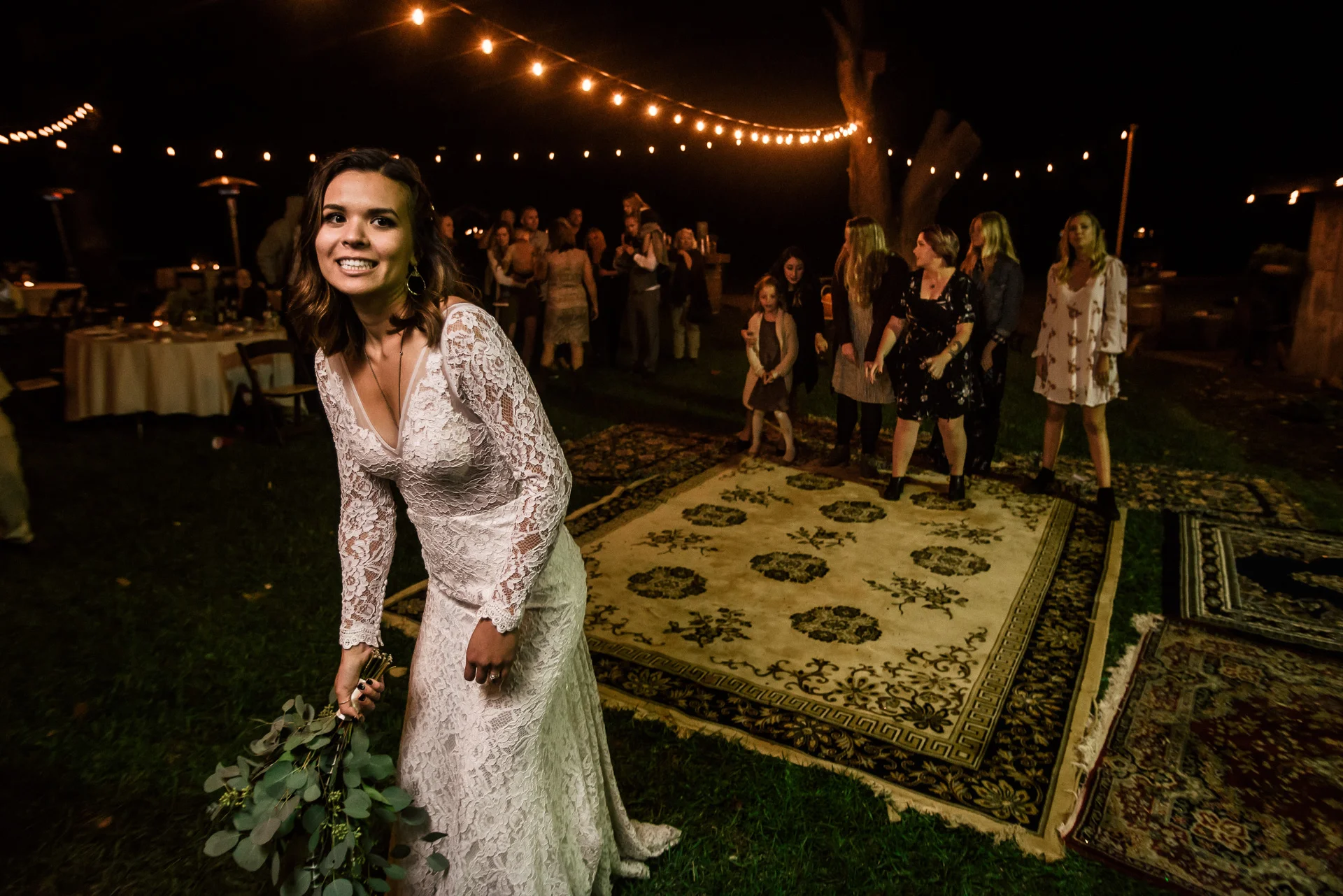 bride gets ready to throw her bouquet at rustic pymm ranch wedding venue in winchester california